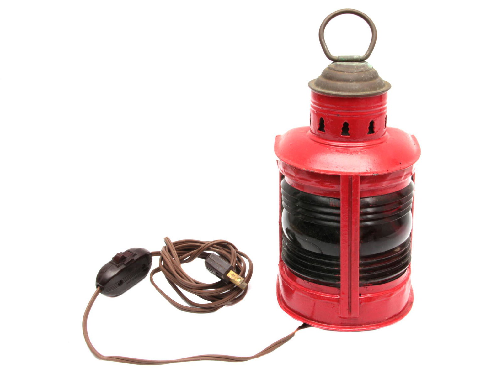 A VINTAGE ELECTRIC SHIP LANTERN: A red painted galvanized ship lantern. With a glass lens of red color, which was necessary for marking at sea (located on the left side of the ship). Dimensions: H: 11 in., (28 cm.)