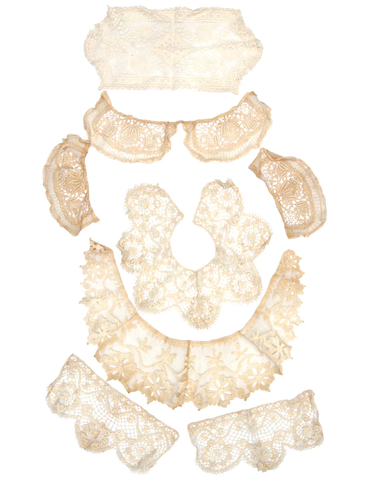 A VINTAGE SET OF LACE ITEMS: The set includes: a lace doily, three lace dress collars and two pairs of cuffs. Delicate, beautifully executed lace in excellent condition.