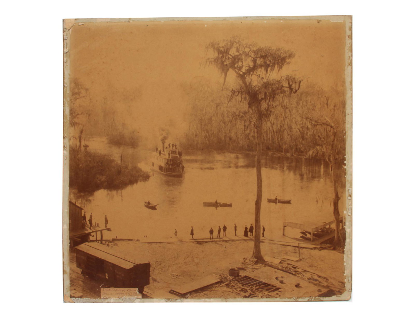 A VINTAGE AMERICAN PHOTO BY GEORGE BARKER CA 1886: A steamboat at Silver Springs photograph by George Barker (1844-1894), landscape Photographer. Signed lower left. With stamps and handwritten marks on the back. Dimensions: 16 x 16 in., (40.5 x 40.5 c