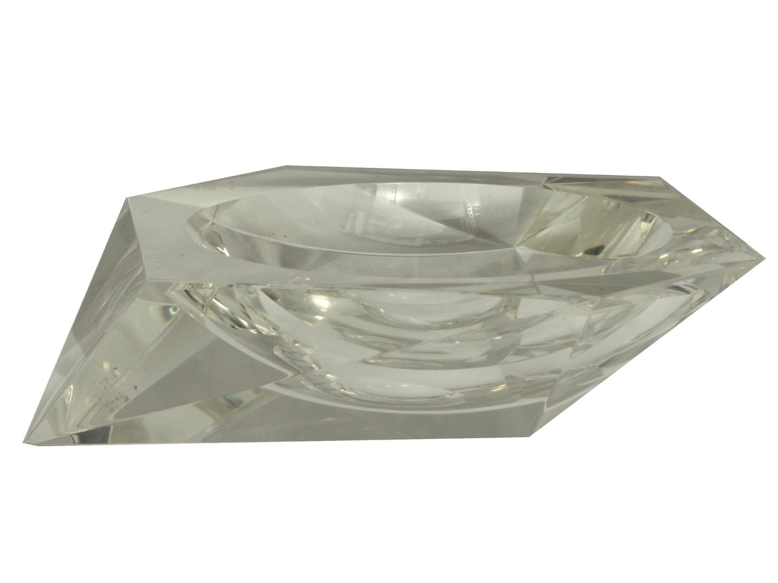 A SOVIET AVANT GARDE GLASS ASHTRAY CIRCA 1930: A Russian Soviet laconic glass ashtray in the shape of a crystal with clear edges. Unusual hexagonal shape with a spherical edge. Produced circa 1930. Dimensions: L: 4 1/4 in.H: 4 in.