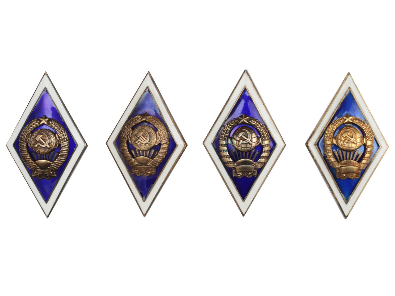 A LOT OF 4 SOVIET GRADUATION SILVER BADGES: This lot includes 4 "University Graduate" Russian badges. The "University Graduate" badge was established in the late 1940's and was given to those who had graduated from a University. ALL SILVER. Tot