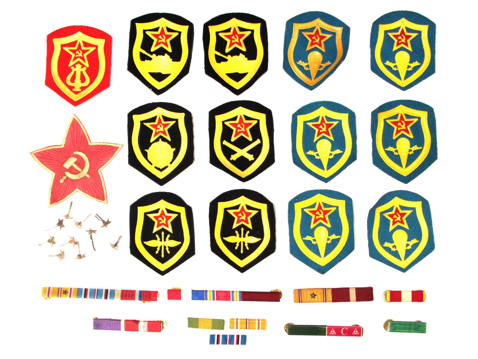 A LOT OF SOVIET PATCHES, PINS, AND MEDAL BARS: This lot includes: 2 Soviet Tank Forces patches, 6 Airborne Troop patches, 2 Signal Corps patches, 1 Artillery Troops patch, 1 Chemical Troops patch, 1 Soviet Army Band patch, a Soviet Hammer and Sick