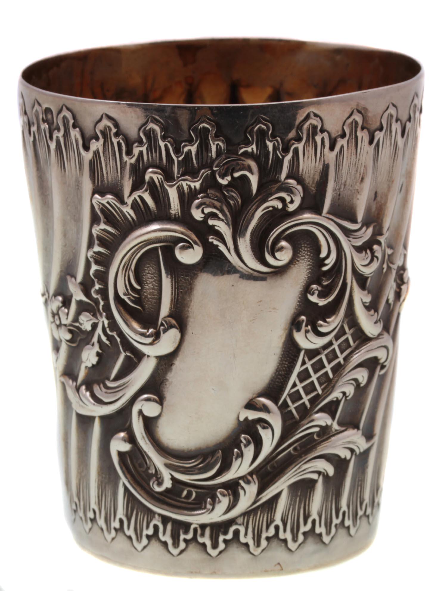 A RUSSIAN 84 GILDED SILVER BEAKER: This rare Russian 84 gilded silver beaker with flower decoration. Marked with silversmith mark and Kokoshnik 84 silver mark. Weight: 89 g. Dimensions: H: 3 in.
