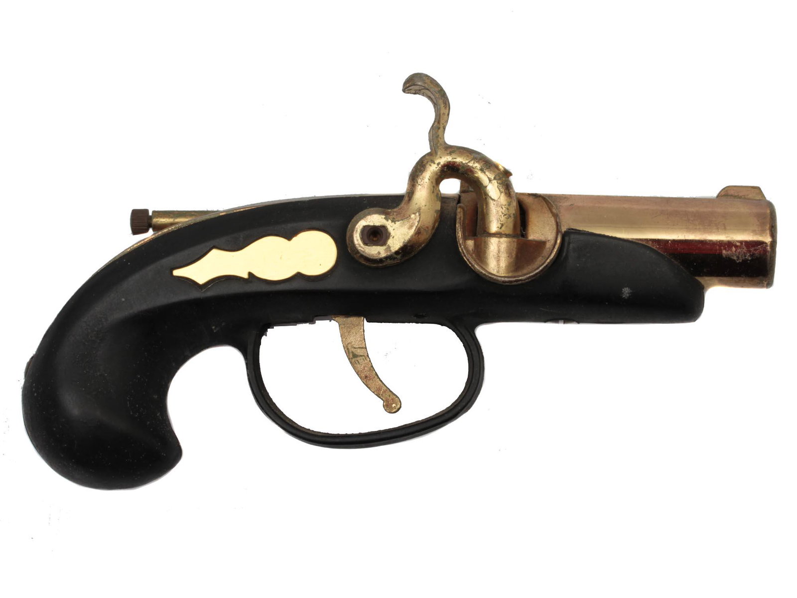 A VINTAGE JAPANESE PISTOL LIGHTER: A vintage Japanese lighter in the shape of a pistol in black with a barrel, trigger and other brass details. With slight abrasions expected with age. Dimensions: L: 6 in., (15 cm.)