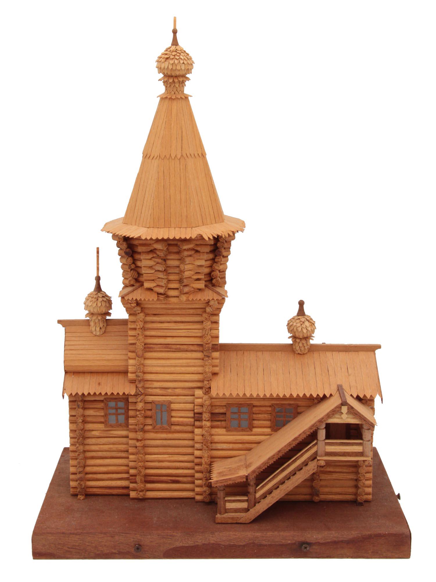 AN ANTIQUE MINIATURE MODEL OF A RUSSIAN CHURCH: An antique wooden Russian orthodox church log cabin model. Circa 1900-1930. Dimensions: H 15 x W 10 3/4 x D 6 1/4 in.