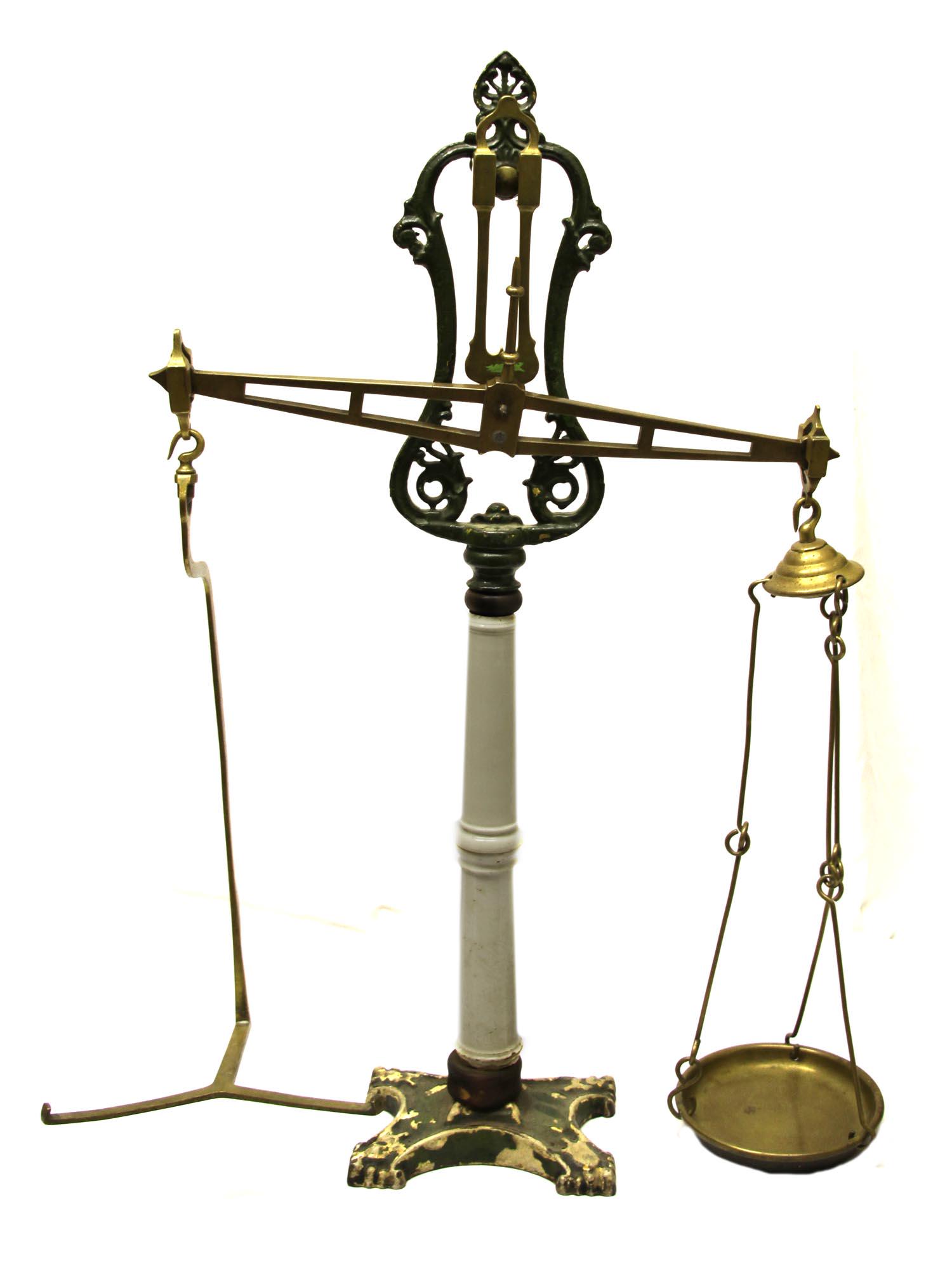 AN ANTIQUE W & T AVERY SHOP BALANCE SCALE: A very rare brass counter grocery scale on white porcelain leg, full set. Dimensions: H 33 in.