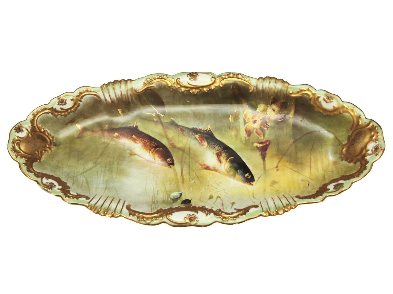 AN ANTIQUE FRENCH LIMOGES PORCELAIN FISH PLATE: An extremely rare in this size Limoges porcelain serving fish plate. Made in France. Circa 19th century. Dimensions: 11 x 23 3/4 in.