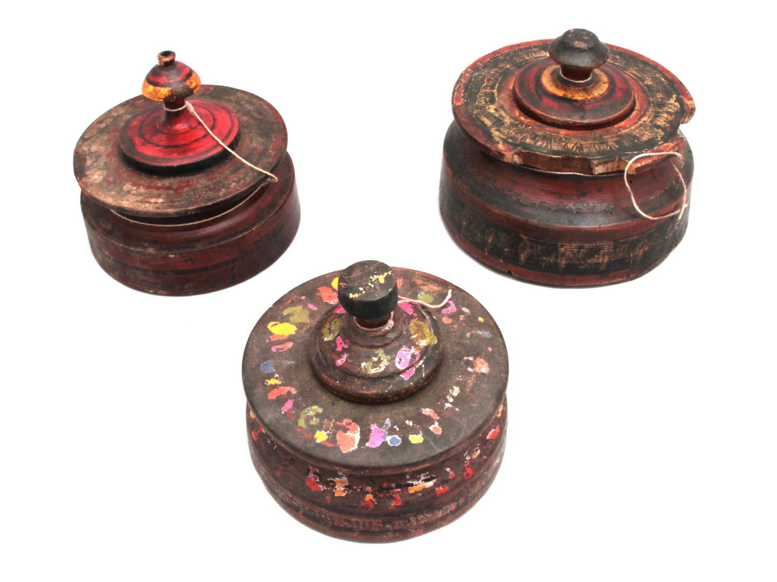 Set of 3 Wooden Spice Containers Sindh, Pakistan: Tall Spice grinder containers with dark red color. Dimensions: Largest: H:3.1" D: 5.4"