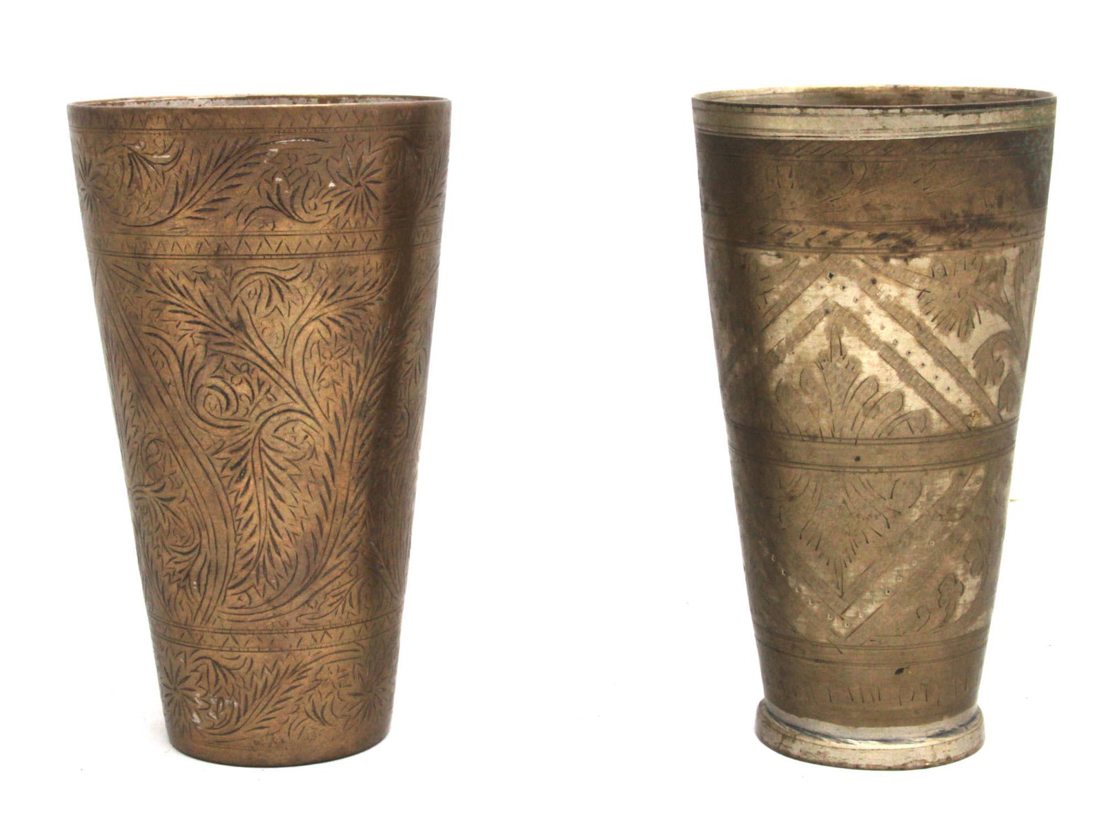 A Pair of Hand Made Brass Yogurt Drink Glass.: Yogurt Drink Glasses (Lassi Glasses), Punjab, Pakistan with hand-engraved flowers and leaves all over the glasses.Condition: Very good Dimensions: Large: 6.6" D: 3.6"