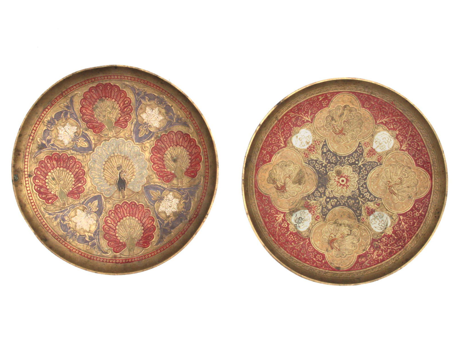 A Vintage Islamic Pair of Brass Plates with peacocks: Vintage Hand made brass plates with peacocks and flower engraving all over in the middle.Condition: Very good. Dimensions: H: 2" D: 8"