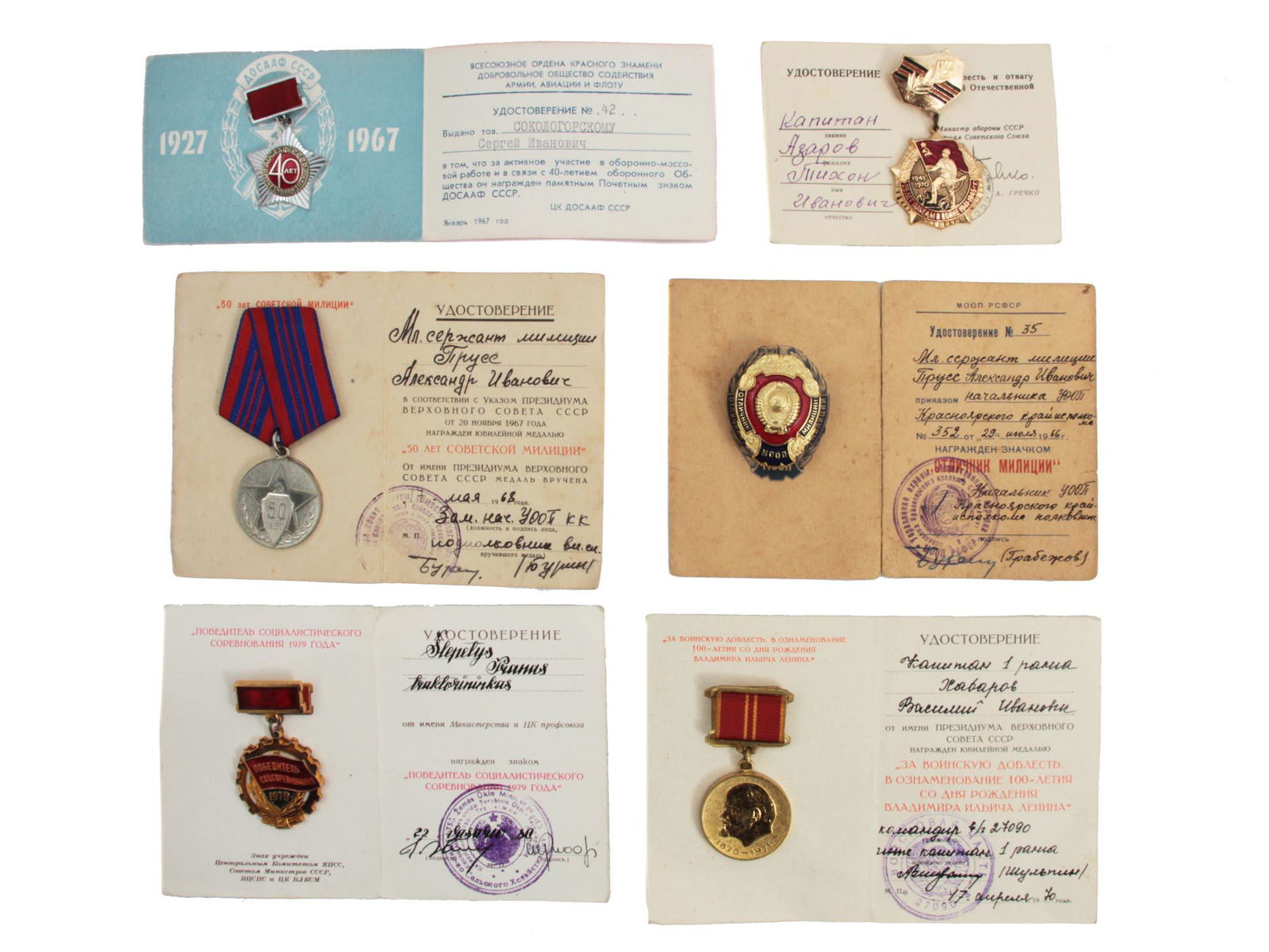 SIX RUSSIAN SOVIET MEDALS / BADGES WITH DOCUMENTS: A lot of six medals and badges with original award documents. Lot includes The Jubilee Medal ("50 Years of the Soviet Militia") and an "Excellent Militiaman" badge both issued to the same person. Dime