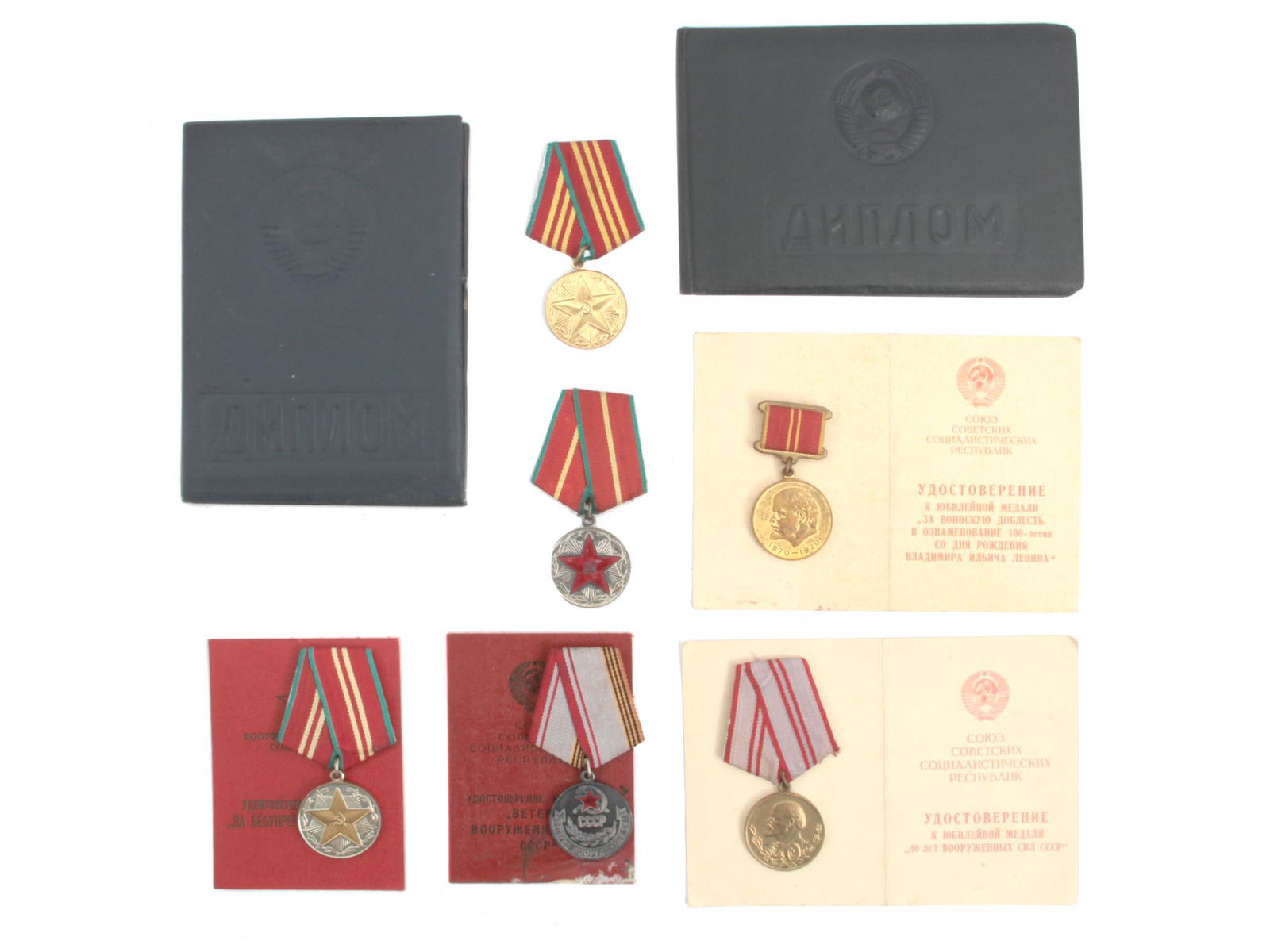 A DOCUMENTED GROUP OF SOVIET RUSSIAN MEDALS: This group contains three Medals for Irreproachable Service in the Armed Forces, 1st, 2nd, and 3rd class, Medal for a Veteran of the Armed Forces, and two University Diplomas. All issued to the same p