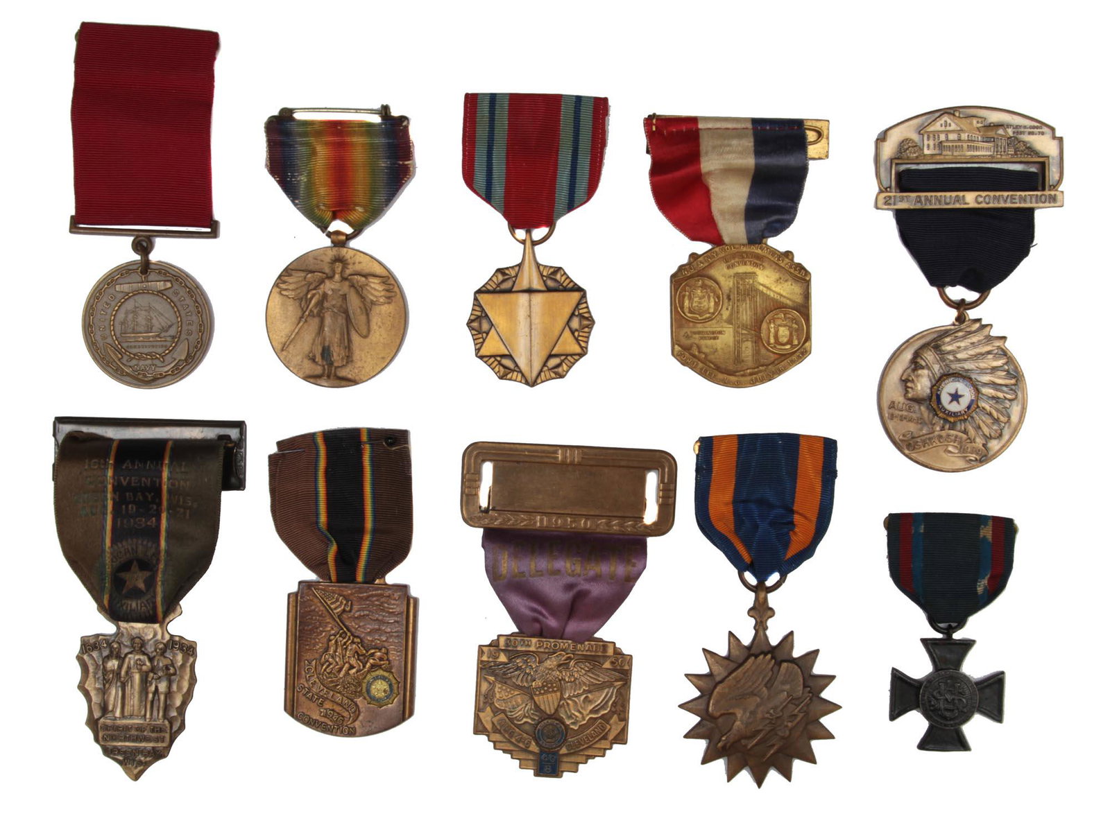 A COLLECTION OF TEN VINTAGE US MILITARY MEDALS: A lot of assorted medals and badges that include: The World War I Victory Award medal, The 1939 American Legion 21st Annual National Convention Medal, Military Service Medal The Air Medal, The America