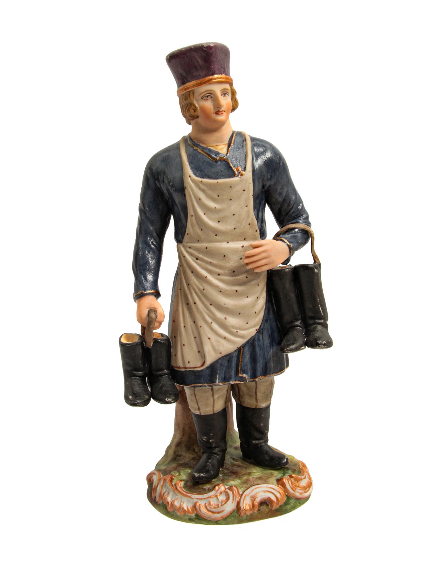 A RUSSIAN GARDNER PORCELAIN FIGURINE LATE 19TH C: A rare antique porcelain figurine "The peddler of boots and shoes". The figurine is made at a high level, the facial features and small details are perfectly executed, the figurine is neatly painted. 