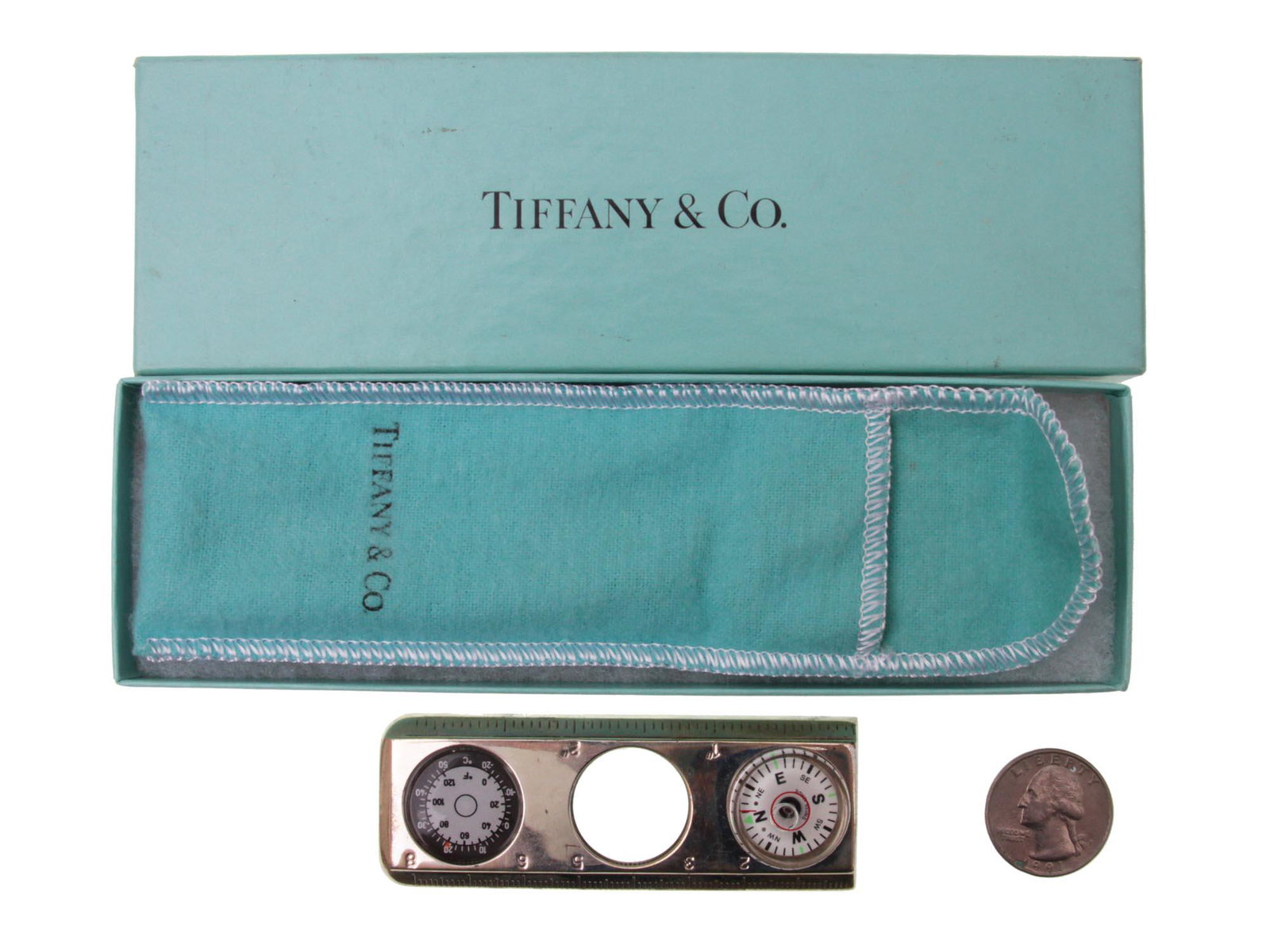 TIFFANY & CO SILVER MAGNIFYING GLASS RULER COMPASS: A beautiful and unique Tiffany & Co. ruler, magnifying glass, compass leveler. The ruler is slightly longer than three inches and also measures in mm's. The first instrument is a fully functional comp