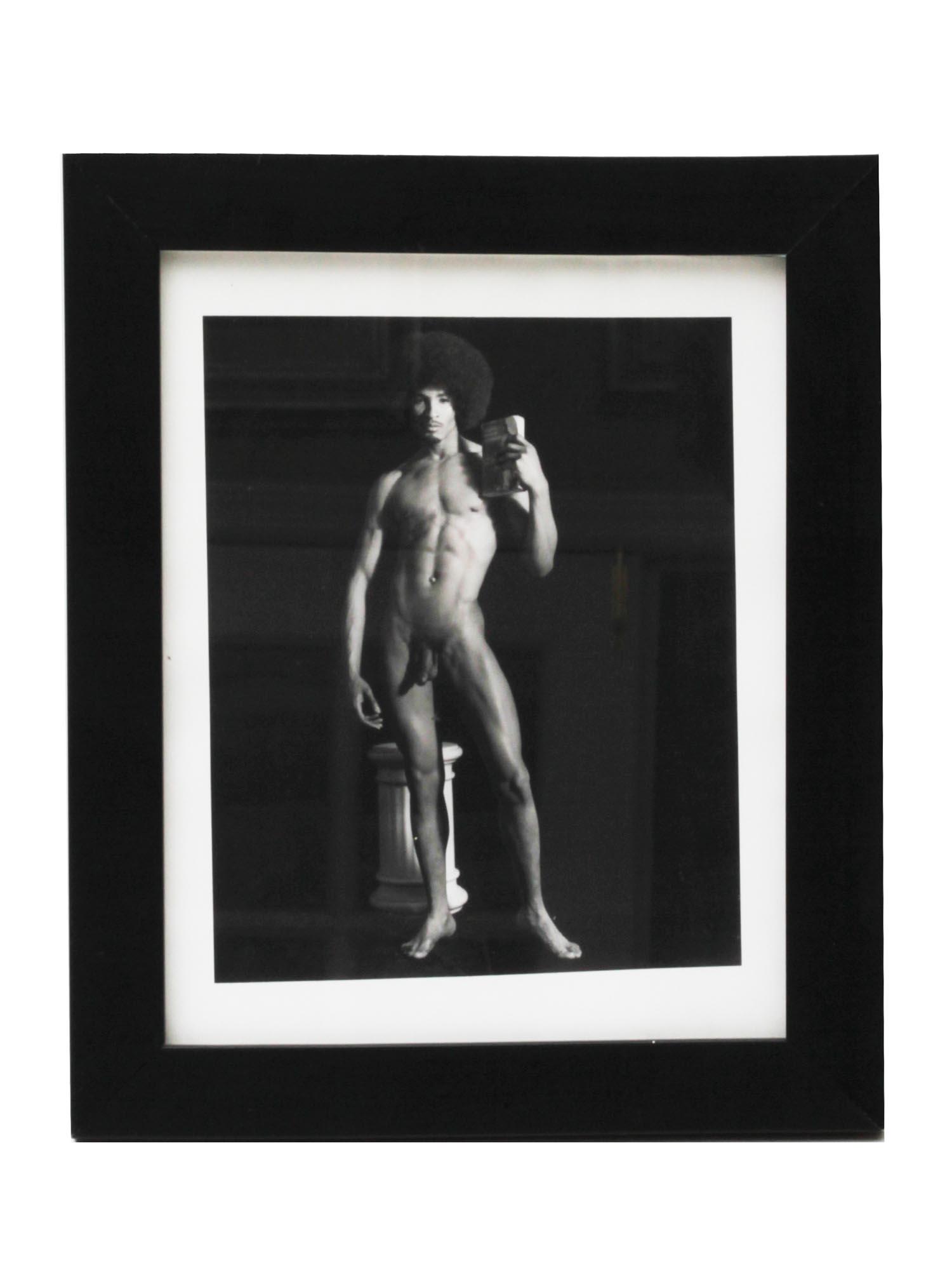A PHOTOGRAPH OF A NUDE MAN BY ARTIST RENEE COX: Gelatin silver print, an original art work of a famous photographer Renee Cox. Signed on the back by artist with pencil. Dimensions: Image size 6 1/2 x 8 in. Frame size 10 x 12 in.
