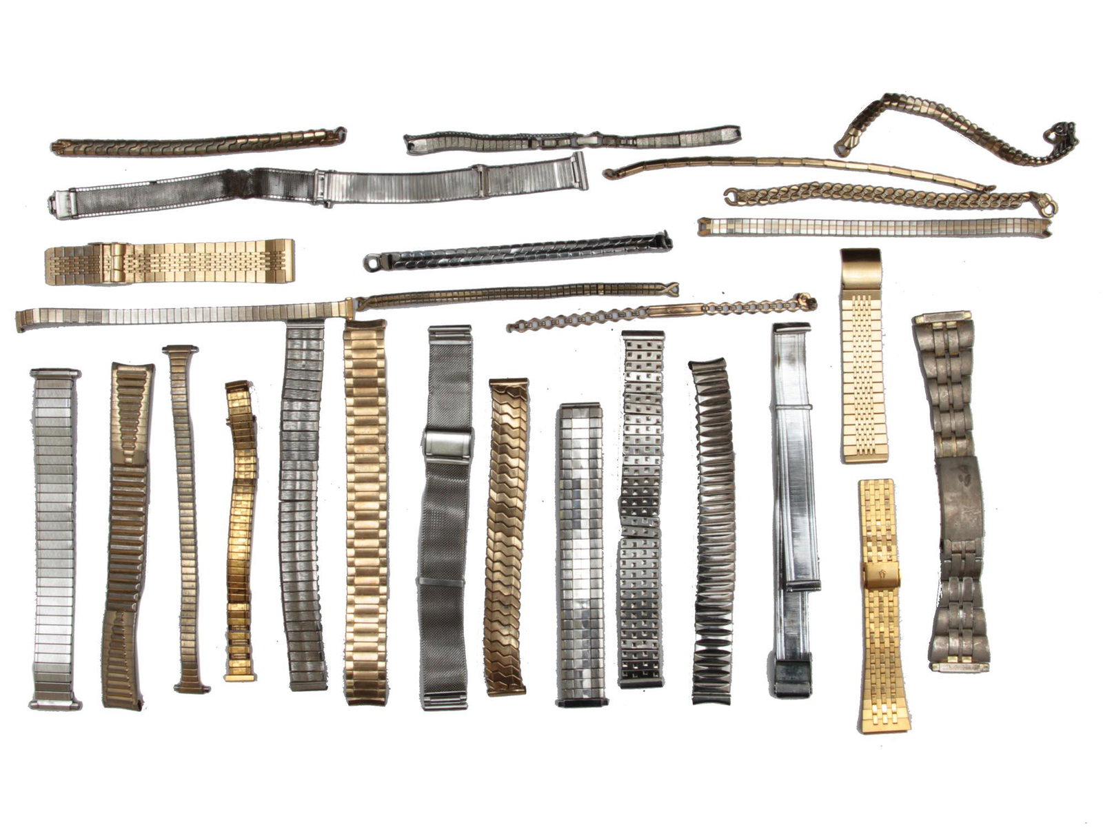A TWENTY SIX VINTAGE WATCH STRAPS AND BRACELETS: This is a group of vintage metal watch bands and bracelets with different designs. Some of the manufacturing companies are: Lenox, Speidel, Hadley, Prema, etc. All circa 20th century. Dimensions: Vari