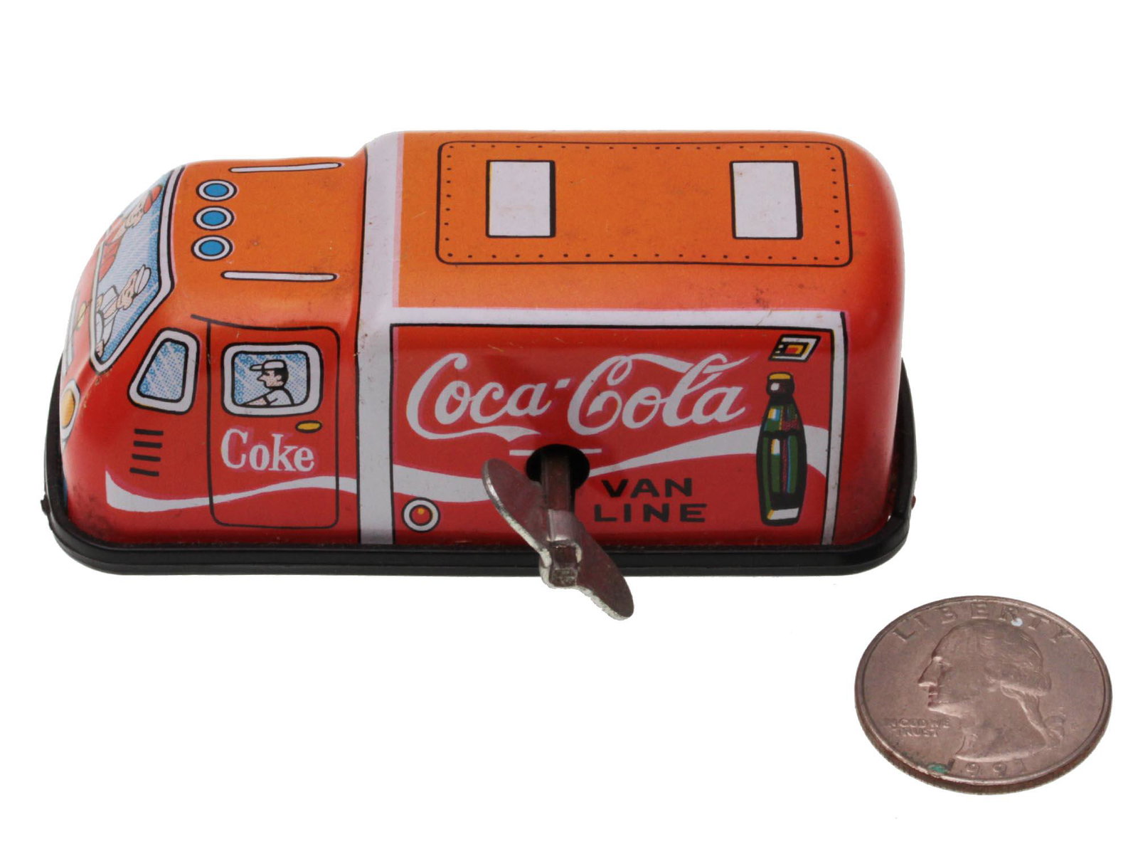 A VINTAGE COCA-COLA TIN TOY WIND UP VAN: A vintage Coca-Cola van line wind up truck made of tin. Manufactured in Japan. Dimensions: 3 x 2 x 1 1/4 in.