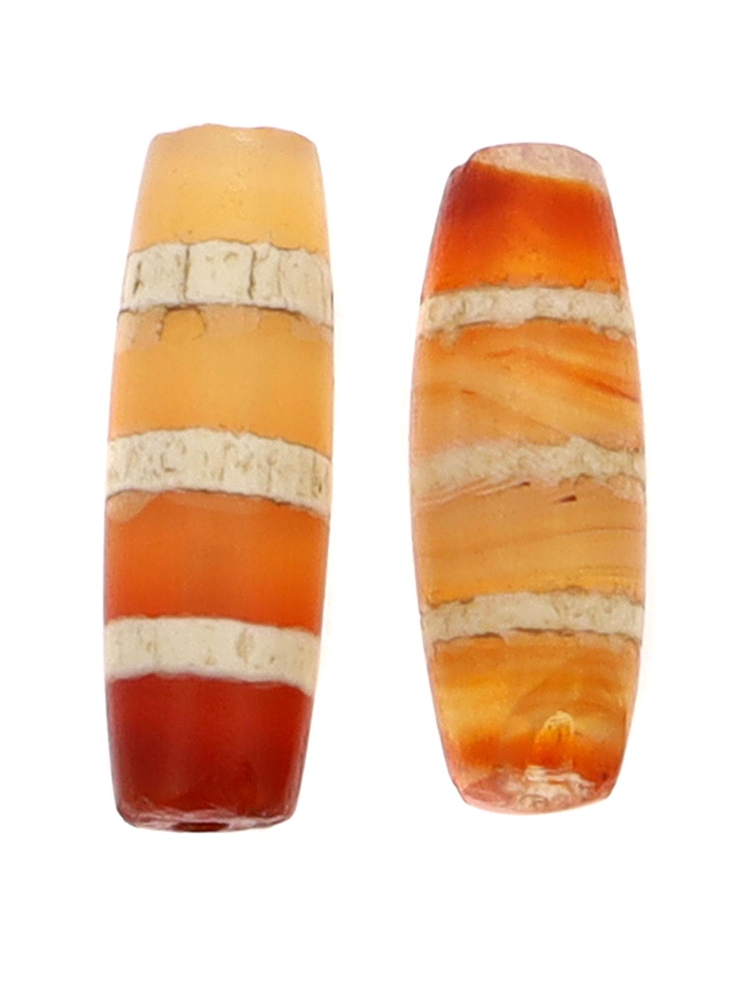 WEST ASIA ETCHED CARNELIAN BEADS, 3000 B.C: Three stripes tubular etched carnelian beads. One bead is chipped at one of the openings. Could also be found in Myanmar, Burma and other parts of Central Asia. Dimensions: L: 9/16 in., 14 mm.