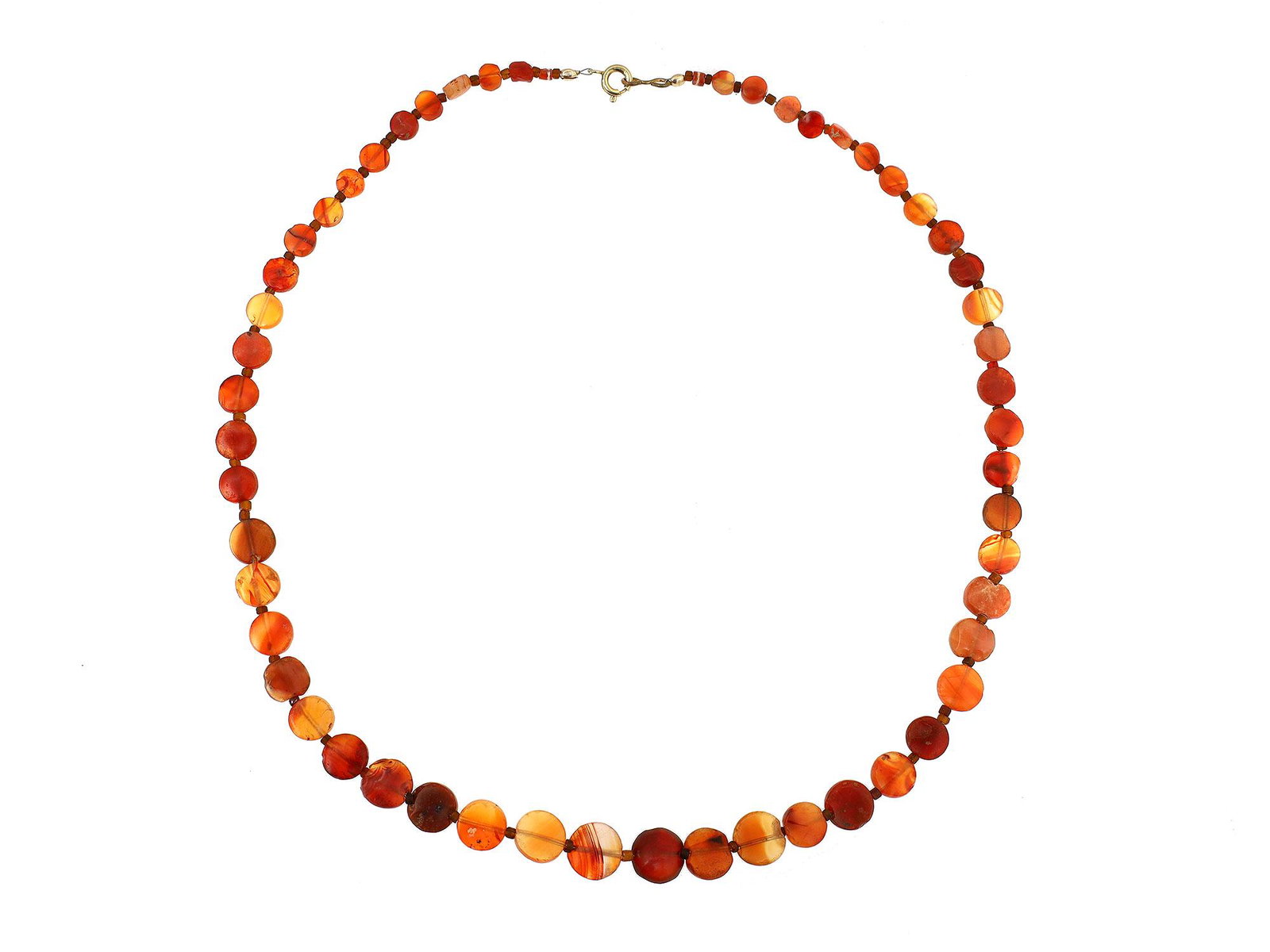 WEST ASIA CARNELIAN BEADS NECKLACE, 2500 BC: Composed of flat round carnelian beads, graduated in size, interspersed with glass beads; strung with modern spring clasp closure. Dimensions: 19 in.