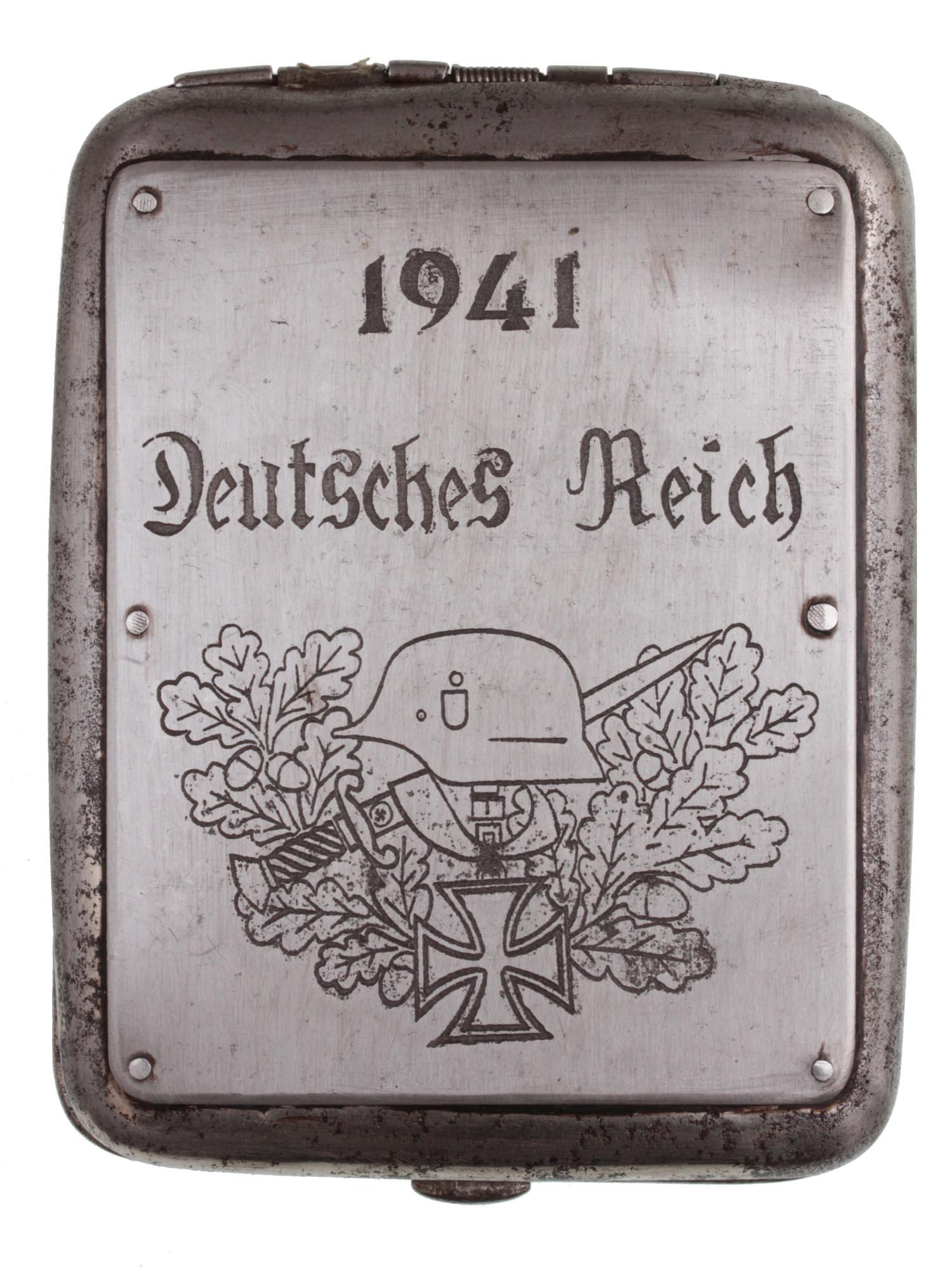 A GERMAN WWII TRENCH ART CIGARETTE CASE: A German WWII cigarette case that was customized by a soldier. It is dated 1941, and it says on the bottom "German Reich." Dimensions: 4 1/4 x 3 1/4 in.