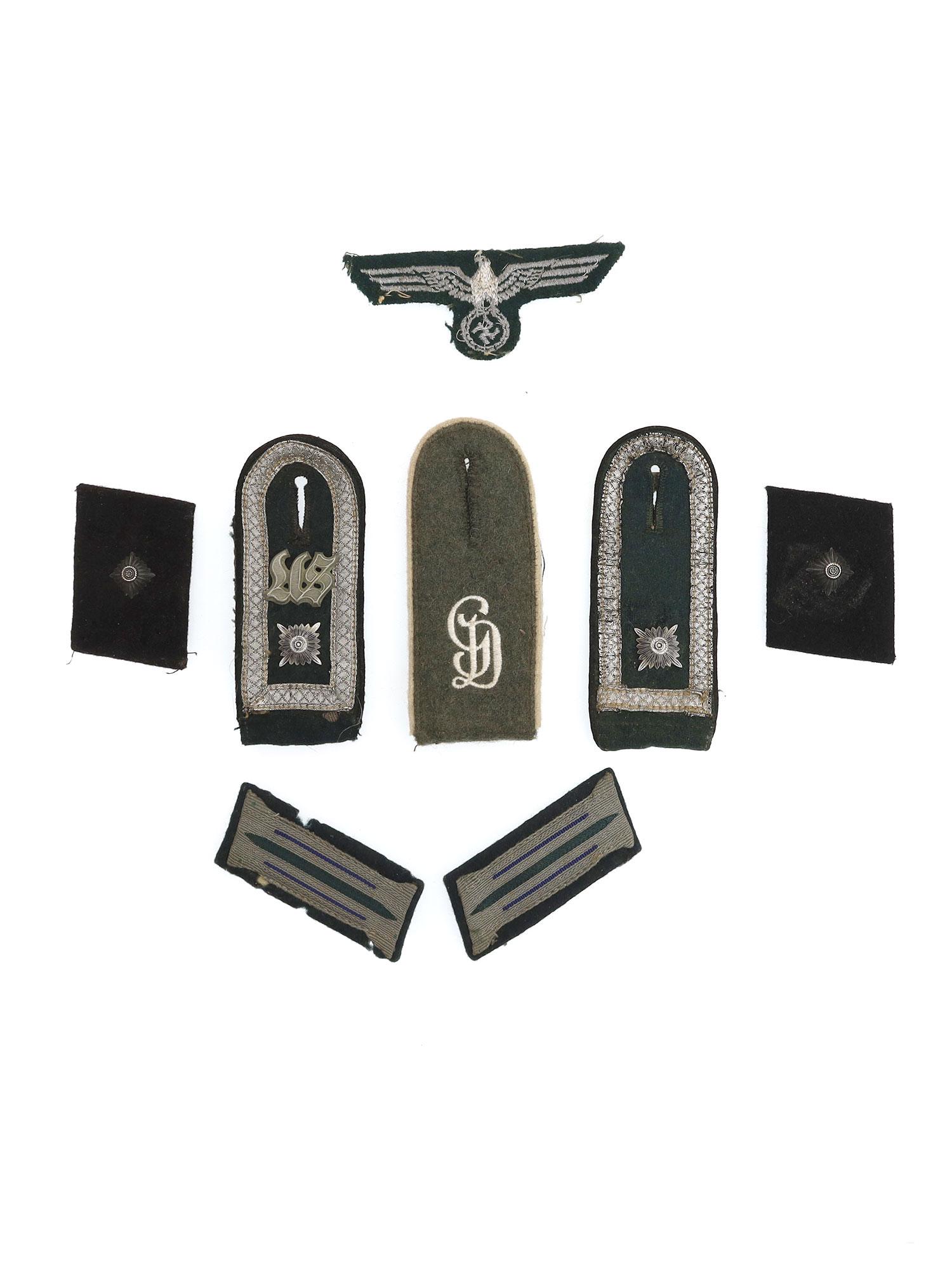 A LOT OF GERMAN WWII PATCHES AND SHOULDER BOARDS: Lot includes: A German Wehrmacht Eagle patch, 3 Shoulder boards, 2 Officer collar tabs, and 2 ranked collar tabs. Dimensions: Smallest: 2 3/4 x 1 1/2 in.Largest: 4 3/8 x 1 3/4 in.Pins: 5/8 in. Approxi