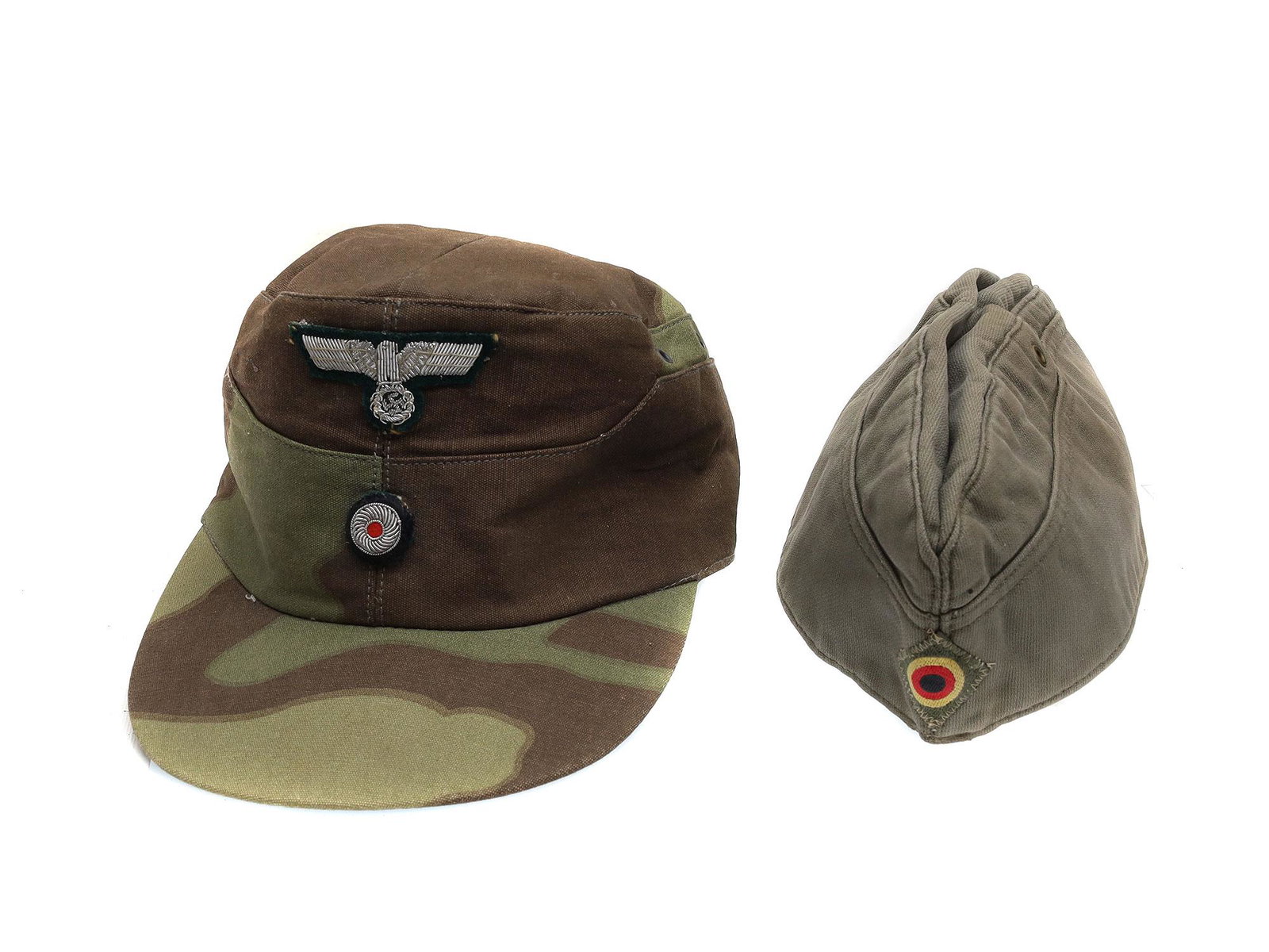A LOT OF TWO GERMAN WWII CAPS: Lot includes one camouflaged M41 German Heer Field Cap dated 1943, and a West German Heer (Army) Overseas Cap Dimensions: Green hat L: 10 1/4 in.Camo hat size: 59