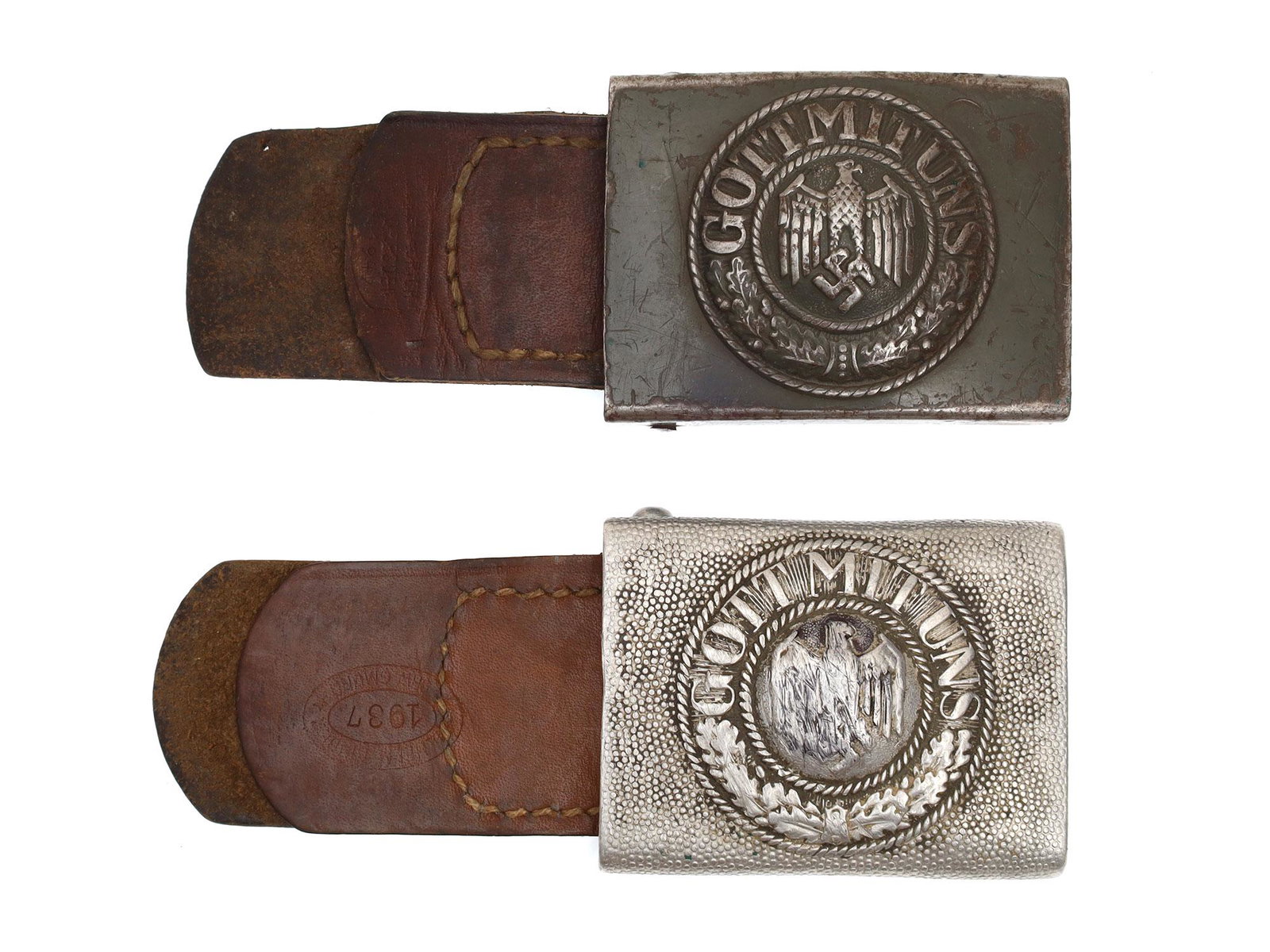 A SET OF TWO GERMAN NAZI BELTS WITH BUCKLES: Two buckles of Wehrmacht Heer "GOTT MIT UNS" (God with us) complete with its original leather tongue-tab, one marked and dated 1937. Dimensions: 2 1/2 x 1 7/8 in.