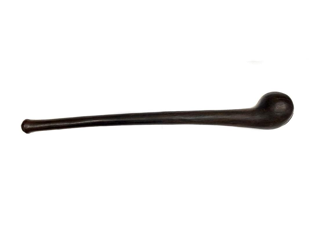 AFRICAN CARVED WOOD TRIBAL WAR CLUB: Slightly curved solid African rosewood war club. Ca. 19th century. Provenance: Collection of Edward Frey (1920-2003) Miami, Florida. Mr. Frey was a known collector and researcher of oriental arms and 