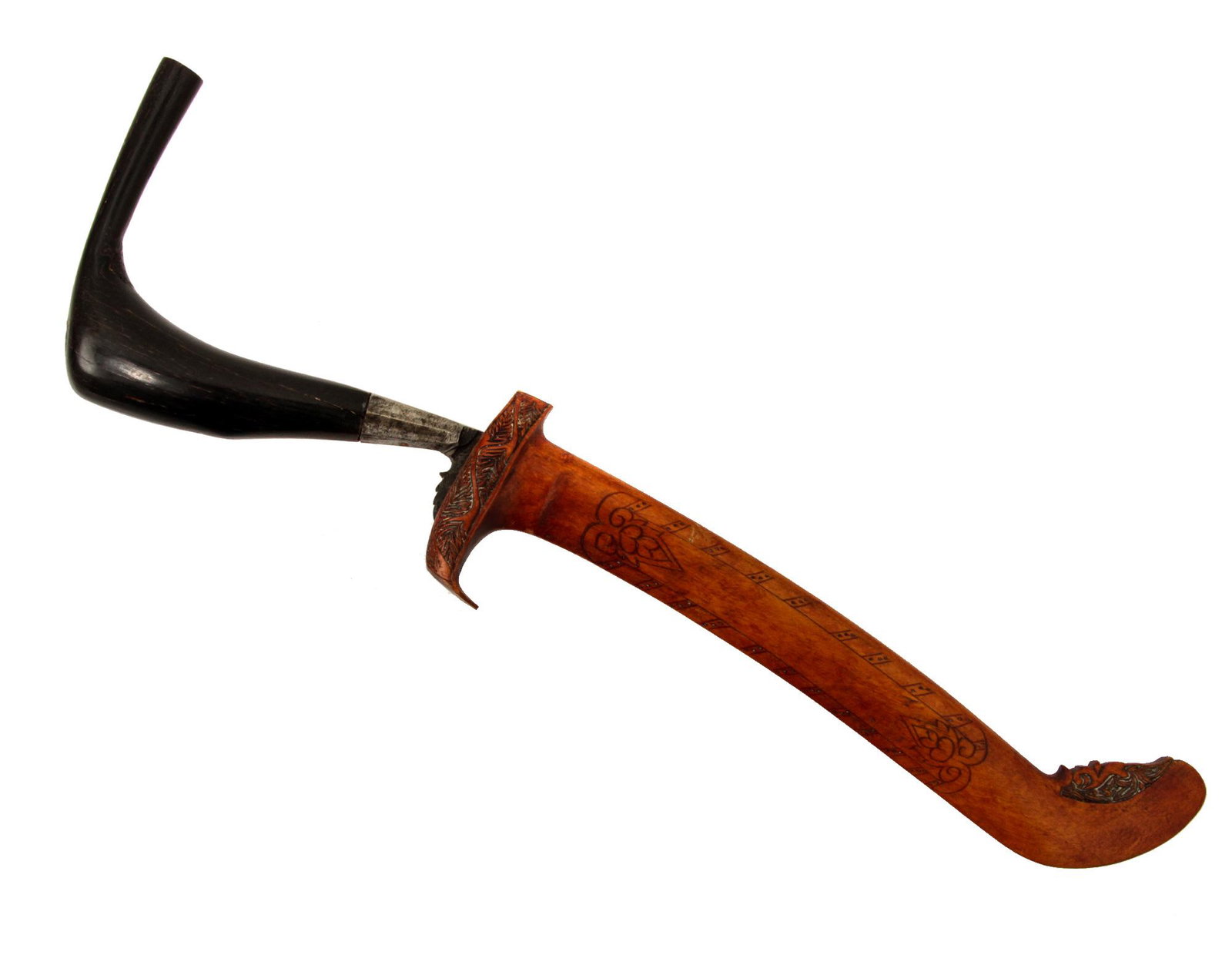 A RENTONG DAGGER KNIFE WITH CARVED SHEATH 19 C: A Rencong with a characteristic dark brown horn hilt, a curved blade with a forged central medial ridge. The sheath is made of wood embellished with carving. Dimensions: L: 12 1/2 in., (32 cm.)