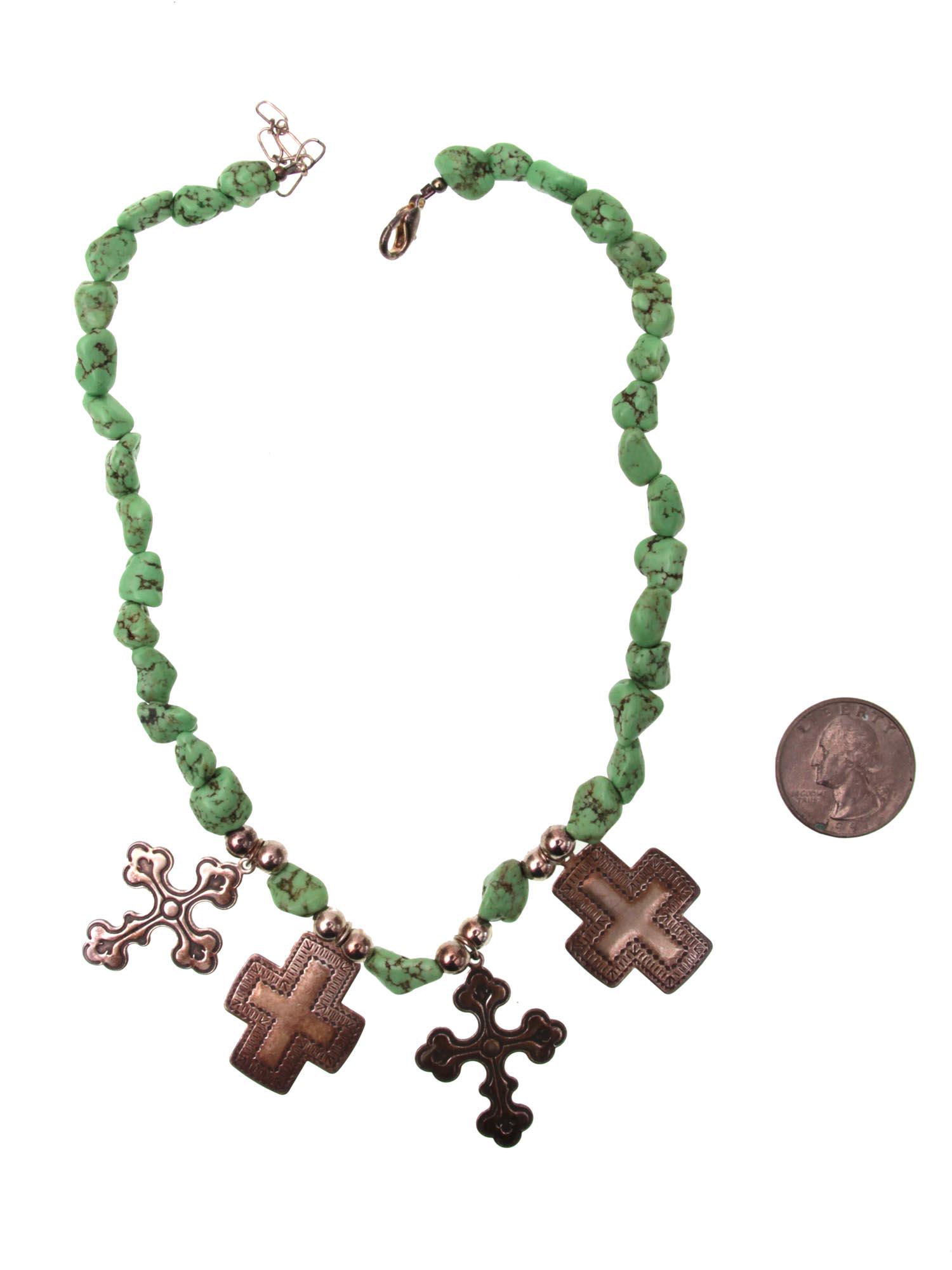 A VINTAGE JADEITE NECKLACE WITH 4 SILVER CROSSES: A beautiful vintage necklace made of green jadeite stones with four pendant crosses, with the Sterling inscription on one piece. Dimensions: 16 in.