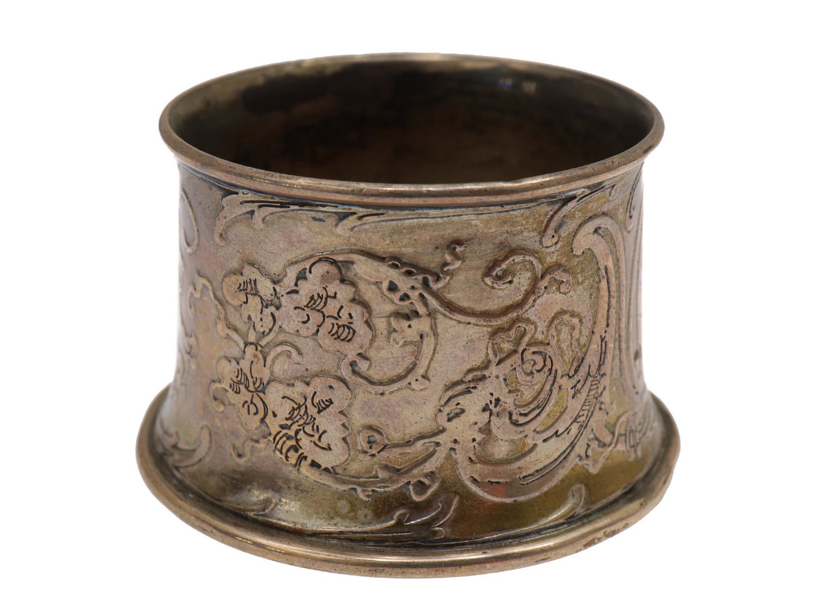 AN ANTIQUE TIFFANY STERLING SILVER SALT CELLAR: An early 20th-century Tiffany salt cellar. The surface is decorated with delicate floral patterns, there are traces of gilding. Manufacturer's marks on the bottom: "TIFFANY & Co / 15233 MAKERS 8912 / 