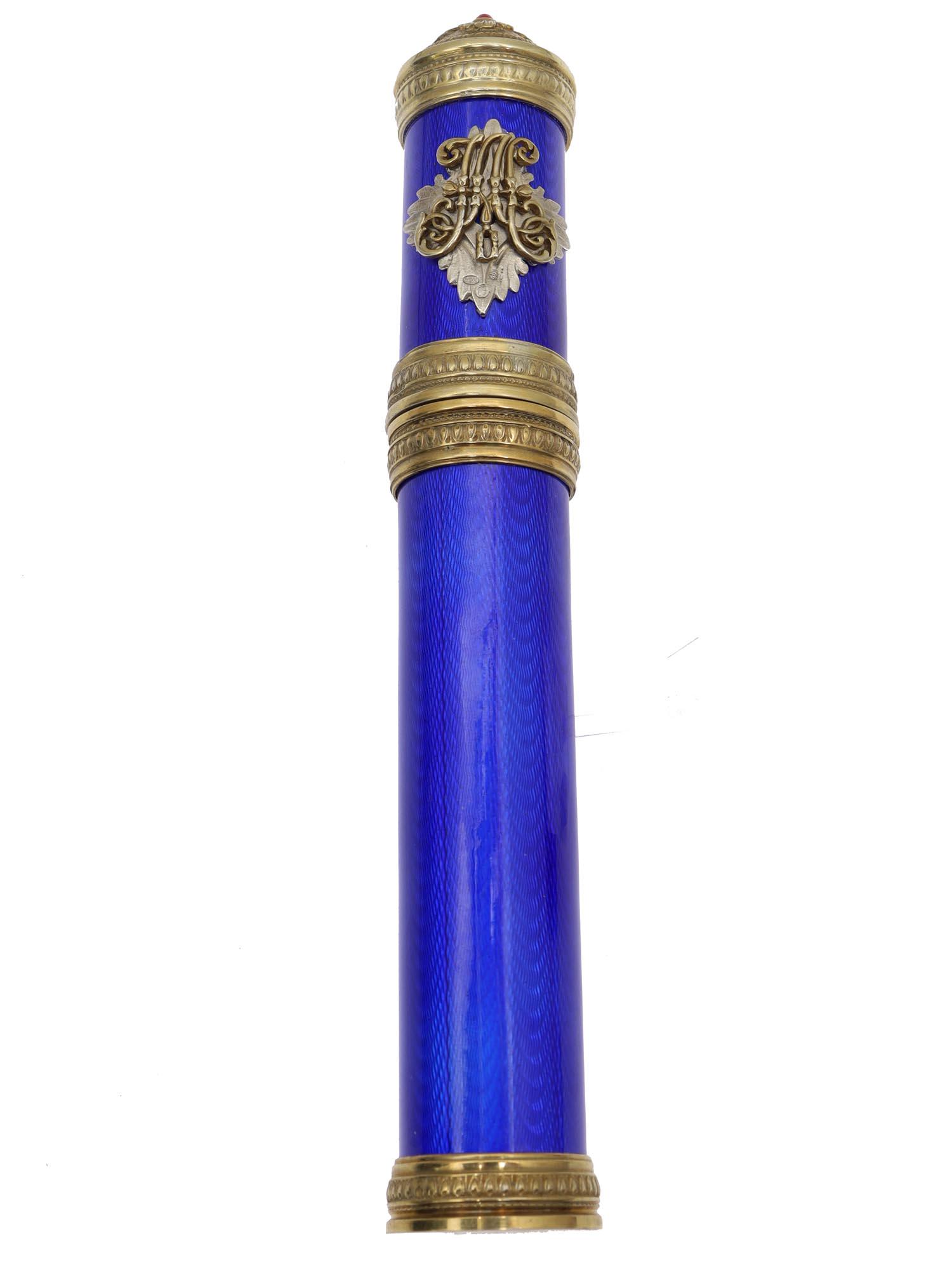 A RUSSIAN SILVER AND GUILLOCHE ENAMEL CIGAR CASE: A Russian cigar case. The surface is covered with cobalt-colored guillochÃ© enamel. The fittings are made of gilded silver, the top of the lid is decorated with a red cabochon, in the center, there 