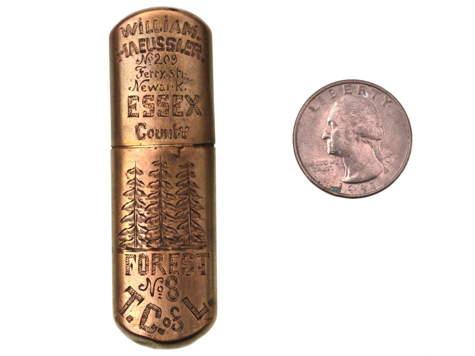 A GERMAN VINTAGE BRASS GASOLINE LIGHTER: A German vintage brass gasoline lighter, engraved with important commemorative pictorial events, dates, and many initials. On the lid front, they are William Haeussler, Essex County. Lower, there are 