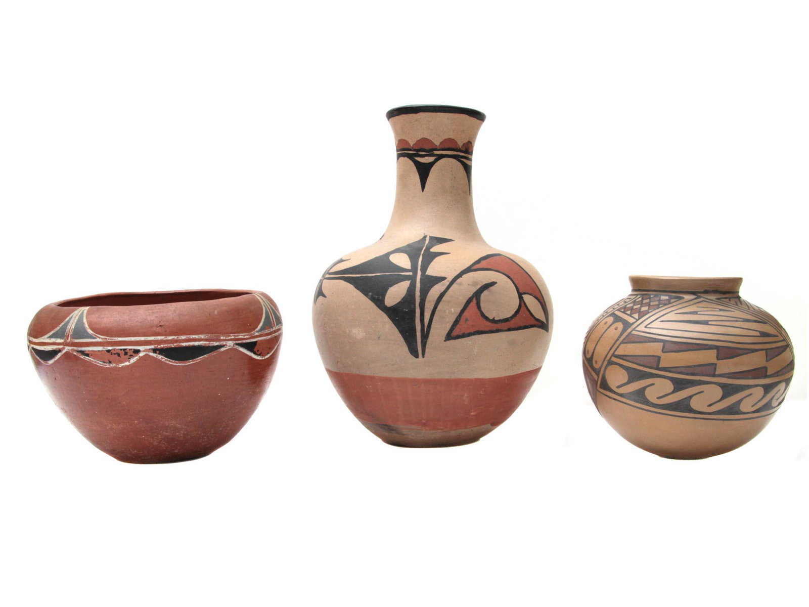 A VINTAGE CASAS GRANDES POLYCHROME VESSELS: A set of three Casas Grandes earthen vessels. These internationally famous pots from the central region of Chihuahua are individually hand-made by descends of the original Casas Grandes potters from 7