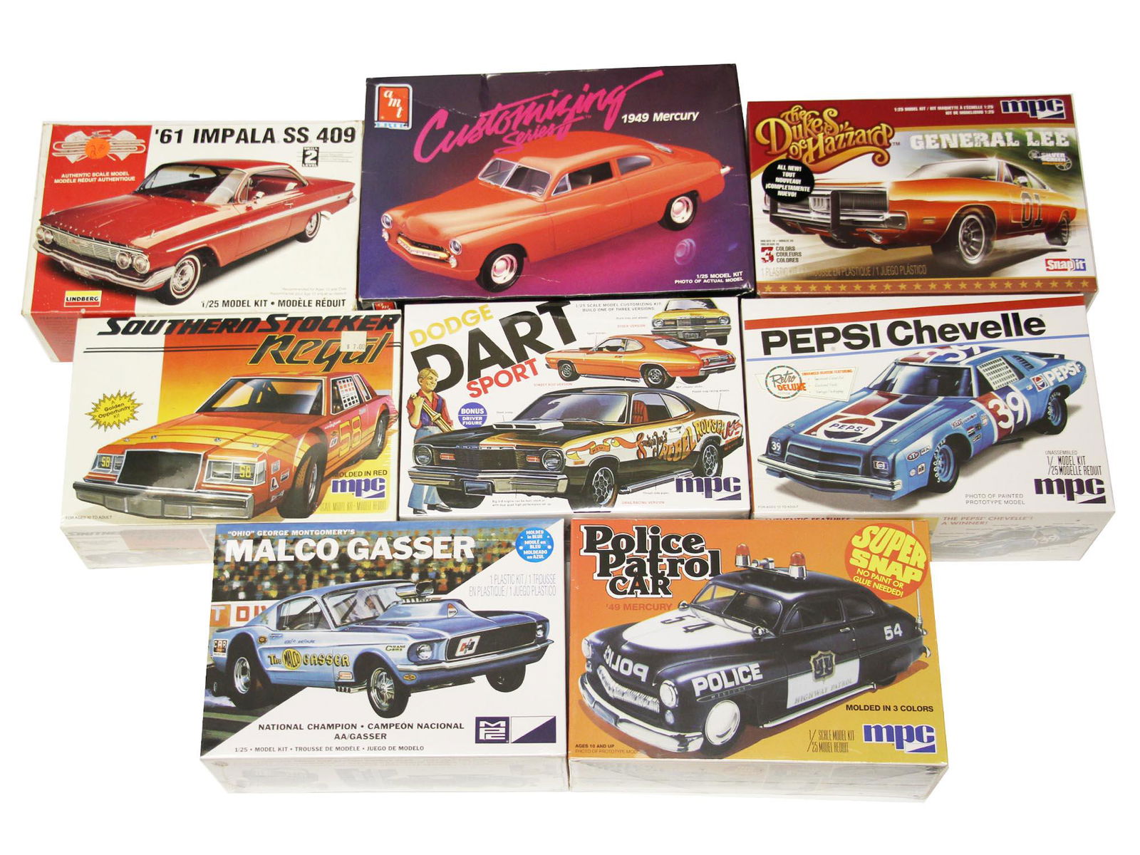 A SET OF 8 VINTAGE AUTHENTIC SCALE CAR MODELS: 1. Authentic scale model. 61 Impala SS 409. Detail photos of actual cars interior. 1/25 model kit. Lindberg. 2. Customizing series. 1949 Mercury. 1/25 model kit. AMT. 3. The Dukes of Hazzard. General