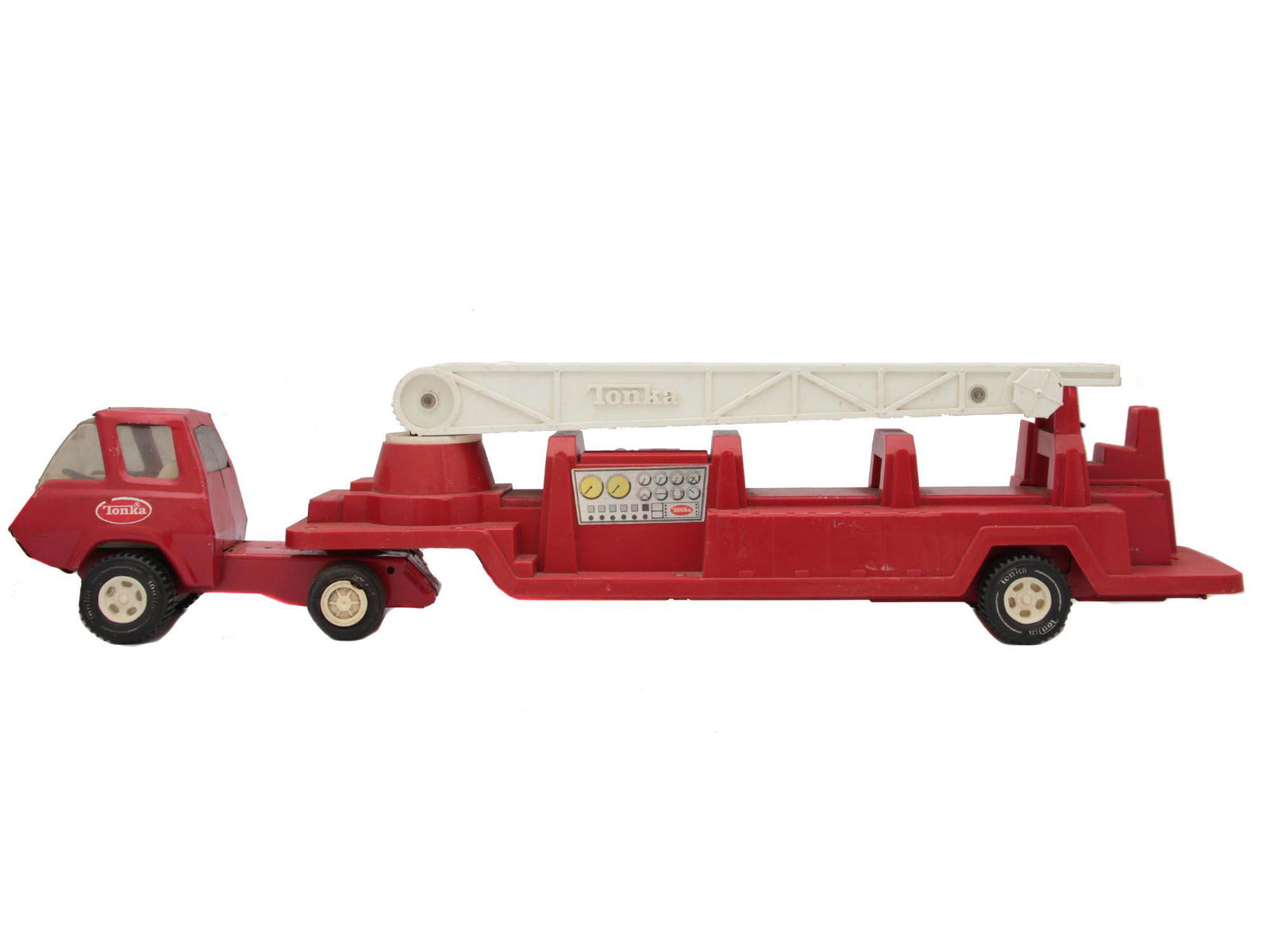 A VINTAGE TONKA TOY OF FIRE TRUCK WITH LADDER: A vintage red Fire Truck diecast toy with trailer aerial ladder from pressed steel by Tonka, an American producer of toy steel models trucks and machinery. Dimensions: 21 1/4 x 4 x 5 in.