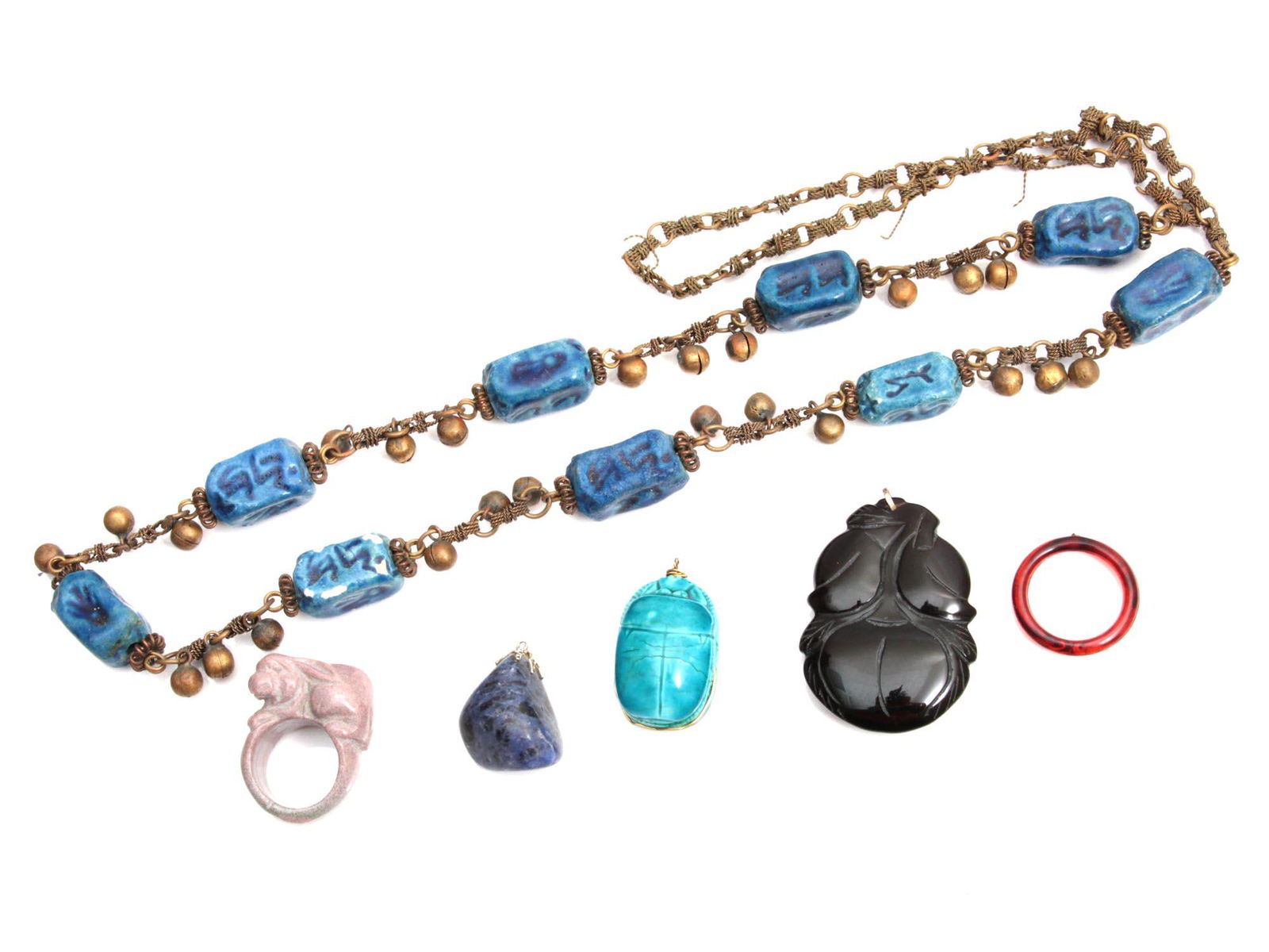 A VINTAGE CHINESE JEWELRY NECKLACE PENDANT RING: A lot of assorted vintage custom jewelry items. Included: Pink granite ring carved in rabbit shape, Blue Lapis stone pendant, Carved black onyx pendant, Egyptian ceramic pendant in turquoise color wit