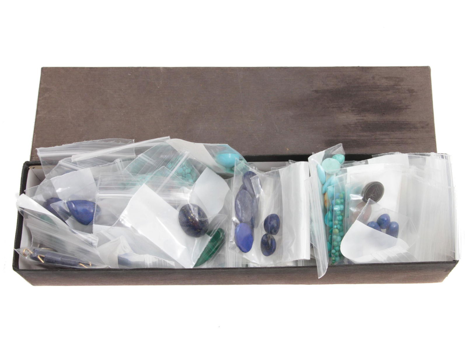 A LOT OF COMPONENTS FOR CUSTOM JEWELRY: A large lot of components for custom jewelry fabrication. Most of the components are semi-precious stones, lapis lazuli, aventurine, malachite, turquoise, jade, and other, packed in separate plastic b