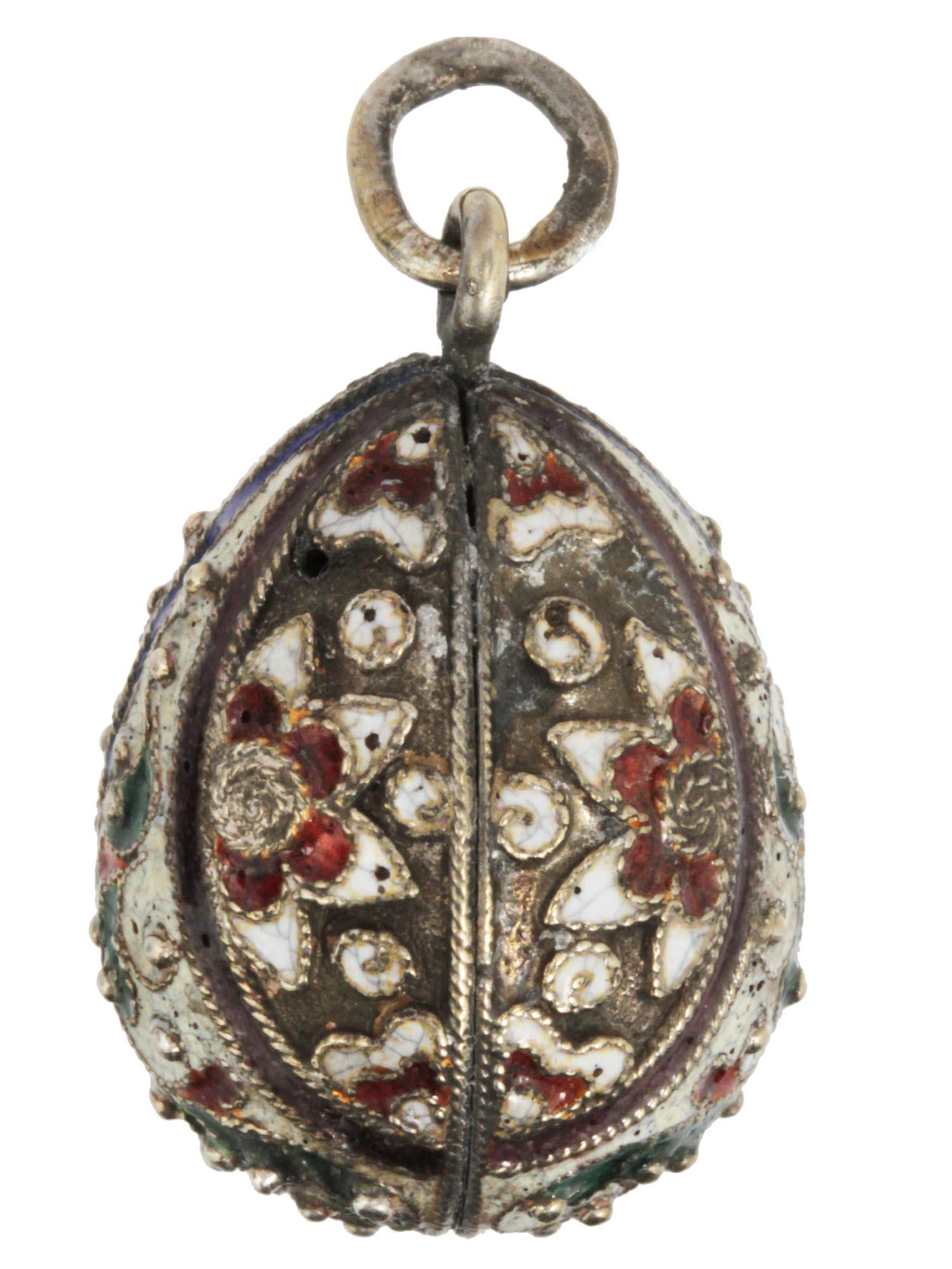 A RUSSIAN GILDED SILVER AND ENAMEL EGG PENDANT: A Russian gilded silver egg pendant with the floral patterns exterior from brown, white, green, and blue enamel with gilded silver, cultured pearls, and a surmount loop on top, marked with Russian hal