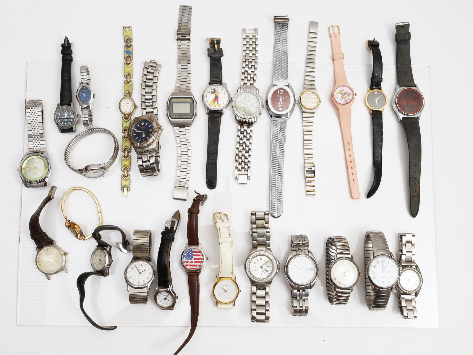 A LOT OF 26 VINTAGE ASSORTED WRIST WATCHES: This is a lot of Collectible wrist watches for men and women, some of the manufacturing companies are: Elgin, Concord, Hamilton Electra, Geneva, Walt Disney Productions, Seiko, Scoop, Voken, Timex, CA