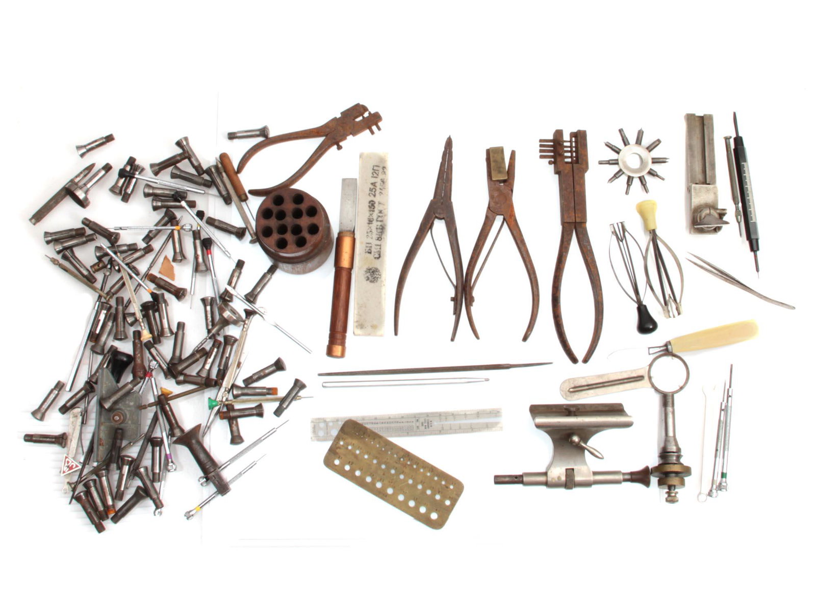 A VINTAGE WATCHMAKER TOOLS CA EARLY 20TH C: A vintage group of various instruments which are necessary for creating and repairing watch movements. From the late 19th to early 20th century. Dimensions: Various sizes.