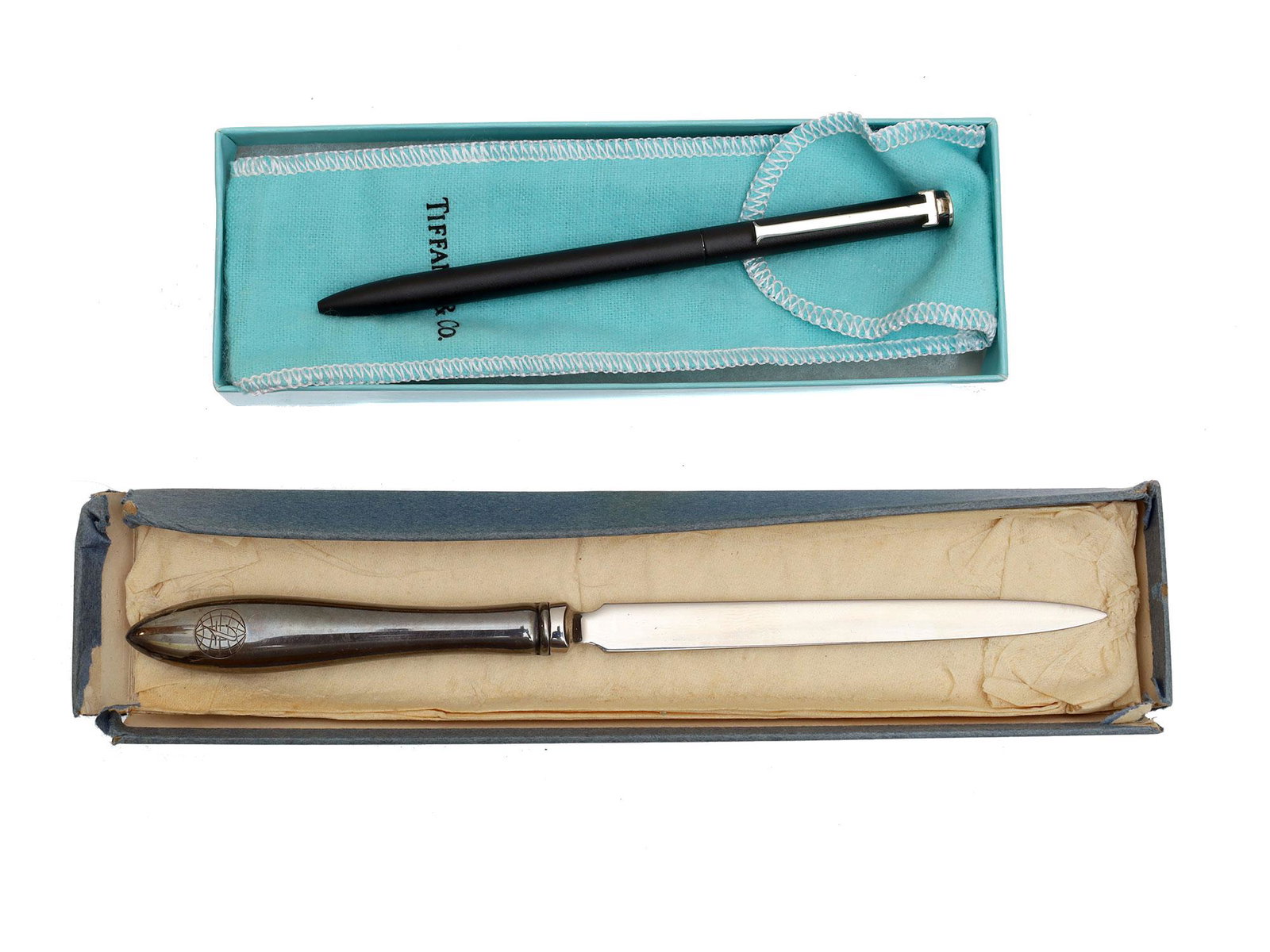A TIFFANY & CO PEN AND A GORHAM LETTER OPENER: The lot includes:1. A vintage sterling silver pen made by Tiffany & Co. Marked "T&CO STERLING." Presented in a branded bag and box. 2. An elegant vintage Gorham sterling silver and stainless steel let