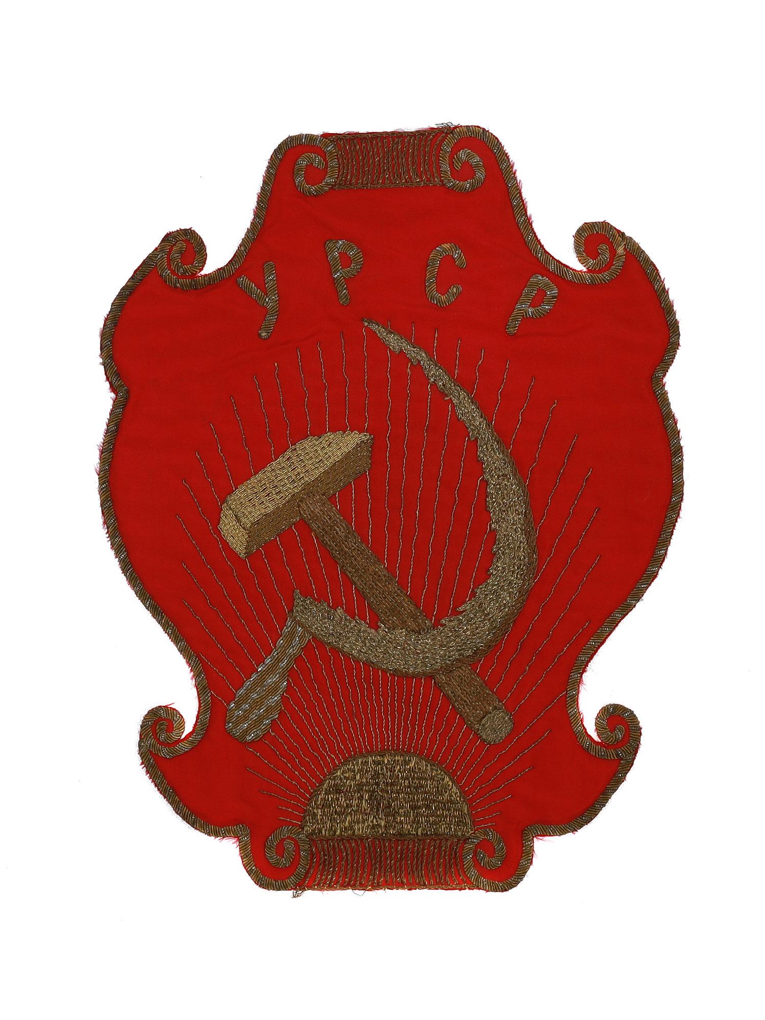 A RARE EARLY UKRAINE EBROIDERED SYMBOL, 1920'S: A rare early Soviet Ukraine banner symbol of the newly-formed Republic. This hand-embroidered with gold and silver thread on a red silk symbol was a part of a large Soviet Ukraine banner made around 1