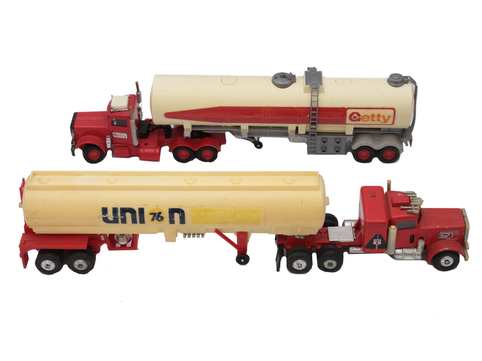 A VINTAGE SET OF TWO DIE-CAST TRUCKS MODELS: The first die-cast truck model is a DTE Macau Matchbox Superkings SK-127 Getty Peterbilt tanker truck, 12" length. The second die-cast truck model is Union 76 Truck & Tanker, 14" long. Truck Peterbilt