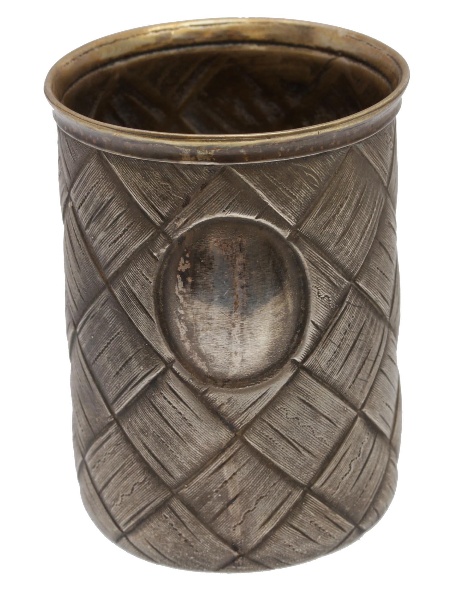 AN ANTIQUE RUSSIAN GILT-SILVER VODKA CUP 19TH C.: A late 19th-century Russian silver vodka cup with imitation of birch bark weaving. Gilded inside. Hallmarks outside under the rim: initials PD (Cyrillic) and 84 silver standard.Weight: 44.3 g. Dimensi