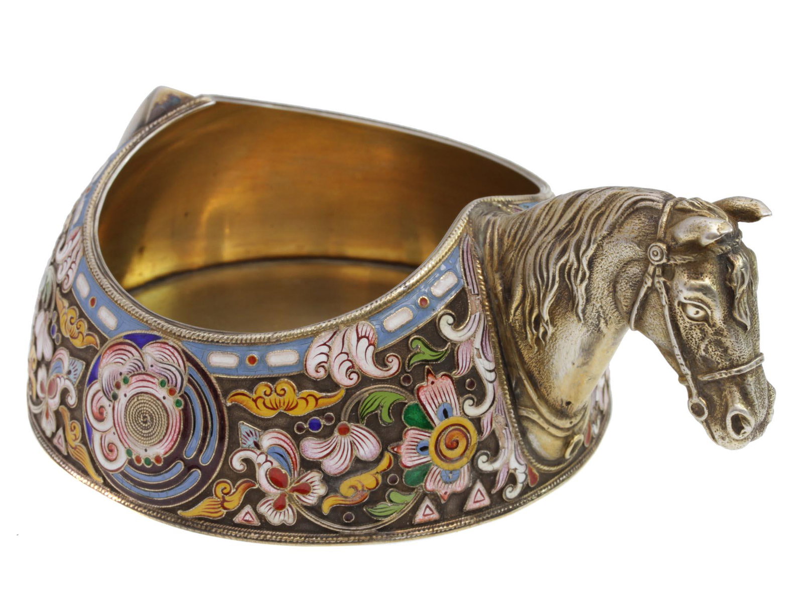 AN ANTIQUE RUSSIAN GILT-SILVER AND ENAMEL KOVSH: An antique Russian gilt-silver ladle. Outside decorated with floral and curls using cloisonnÃ© enamel technique. Figural horse head handle. At the bottom, there is a stamp of a two-headed eagle, 84 