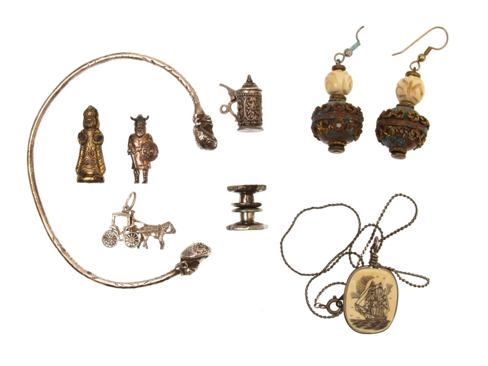 A VINTAGE SILVER JEWELRY BRACELET NECKLACE SILVER: A lot of vintage assorted custom jewelry items. Included: silver bracelet marked with 925, earrings made of green stone beads with carved metal and carved bone beads, a necklace with a metal chain and