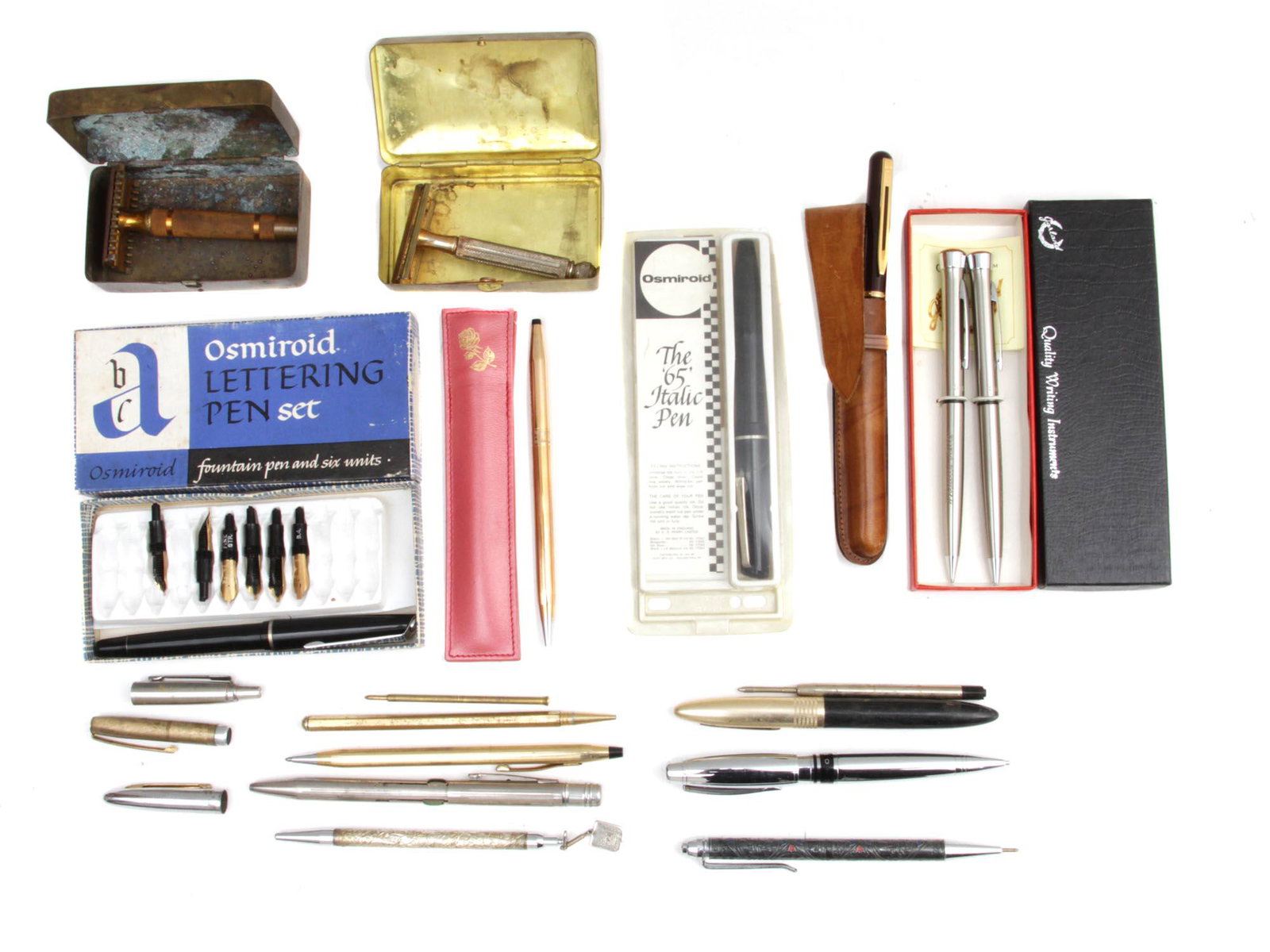A SET OF VINTAGE PENS AND RAZORS: The lot includes several vintage ballpoint pens and refills, two Osmiroid fountain pens in original boxes, and two vintage shaving razors in metal boxes. Dimensions: Smallest L: 4 1/2 in. Largest L: 5