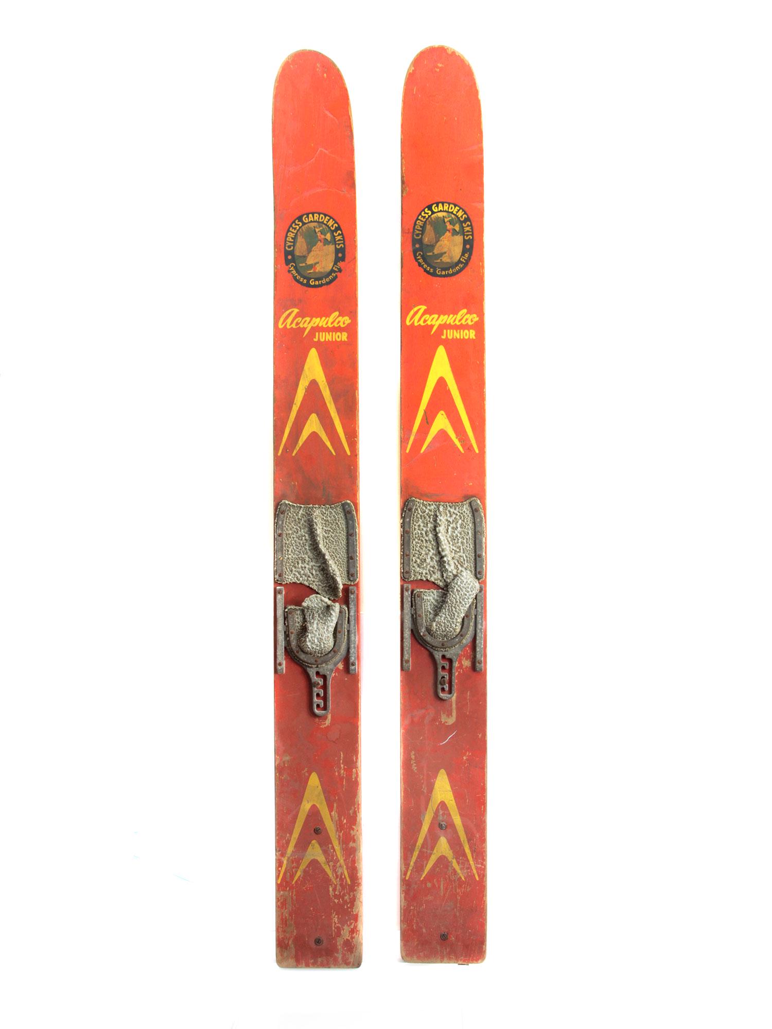 A VINTAGE CYPRESS GARDENS ACAPULKO JUNIOR SKIS: A pair of vintage wooden Cypress Gardens water skis. Dimensions: 63 x 6 in.